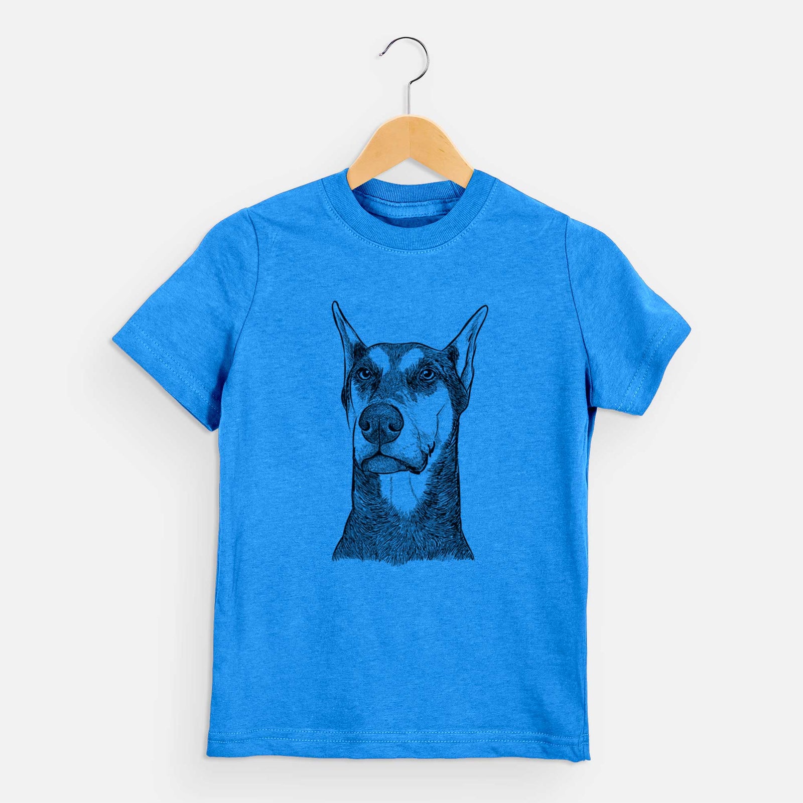 Hand-drawn sketch of Zeus the Doberman Pinscher on a Blue kids' shirt