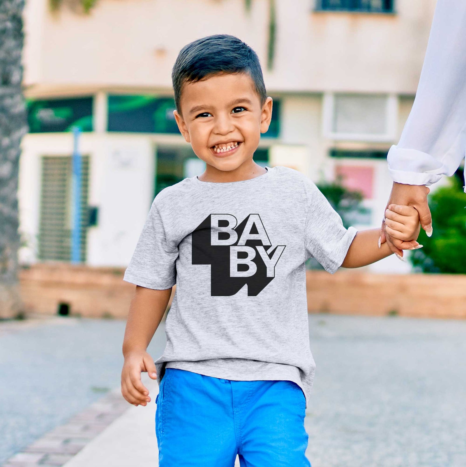'Baby - Blockscape Collection' design on a kids' shirt, worn by a boy