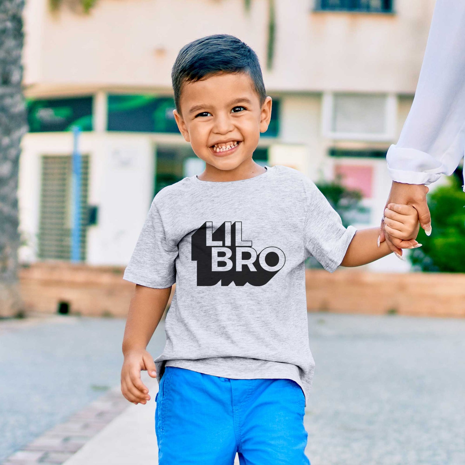 'Lil Bro - Blockscape Collection' design on a kids' shirt, worn by a boy