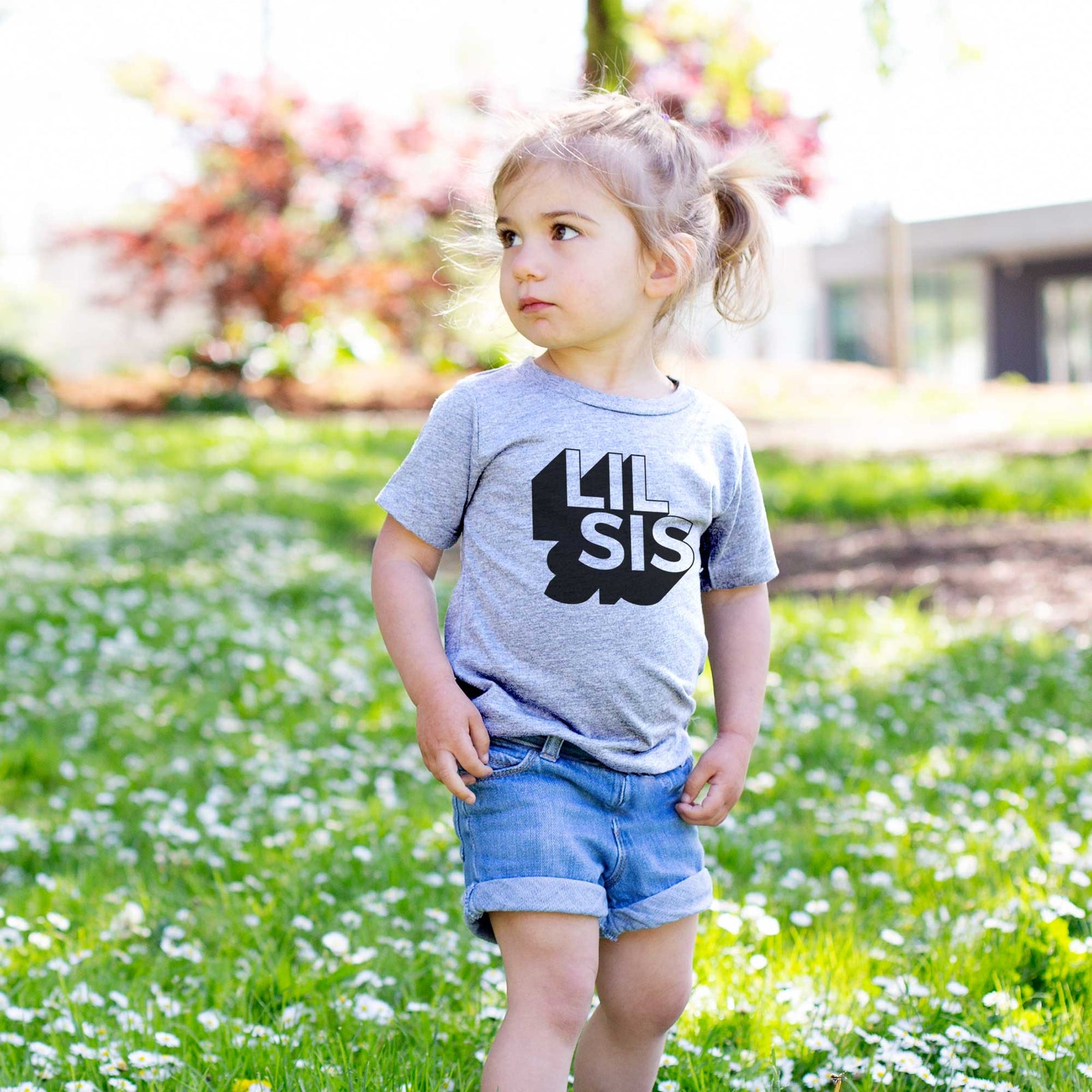 'Lil Sis - Blockscape Collection' design on a kids' shirt, worn by a girl