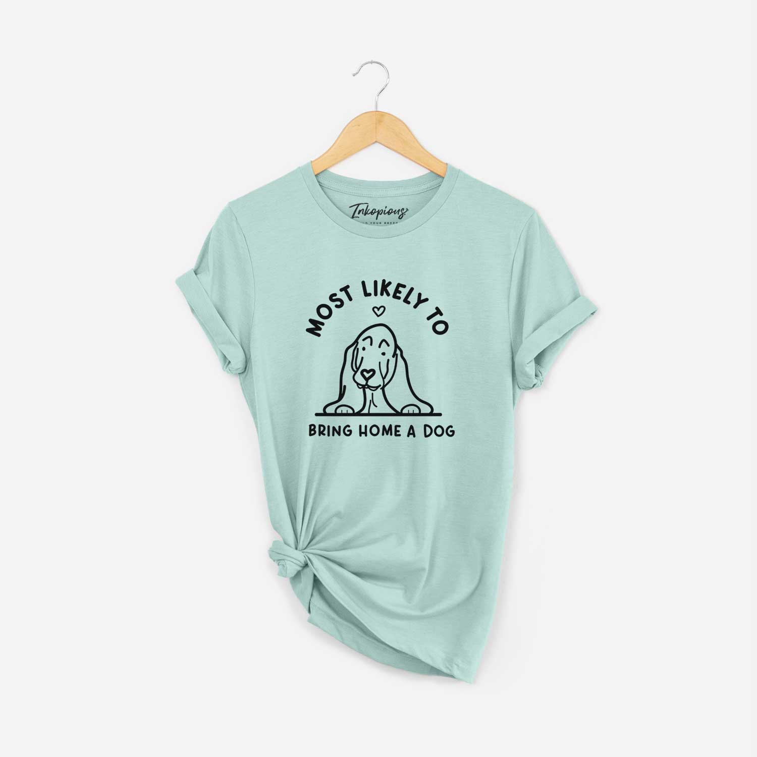'Most Likely to Bring Home a Dog - Basset Hound' design on a Heather Sage Unisex crewneck