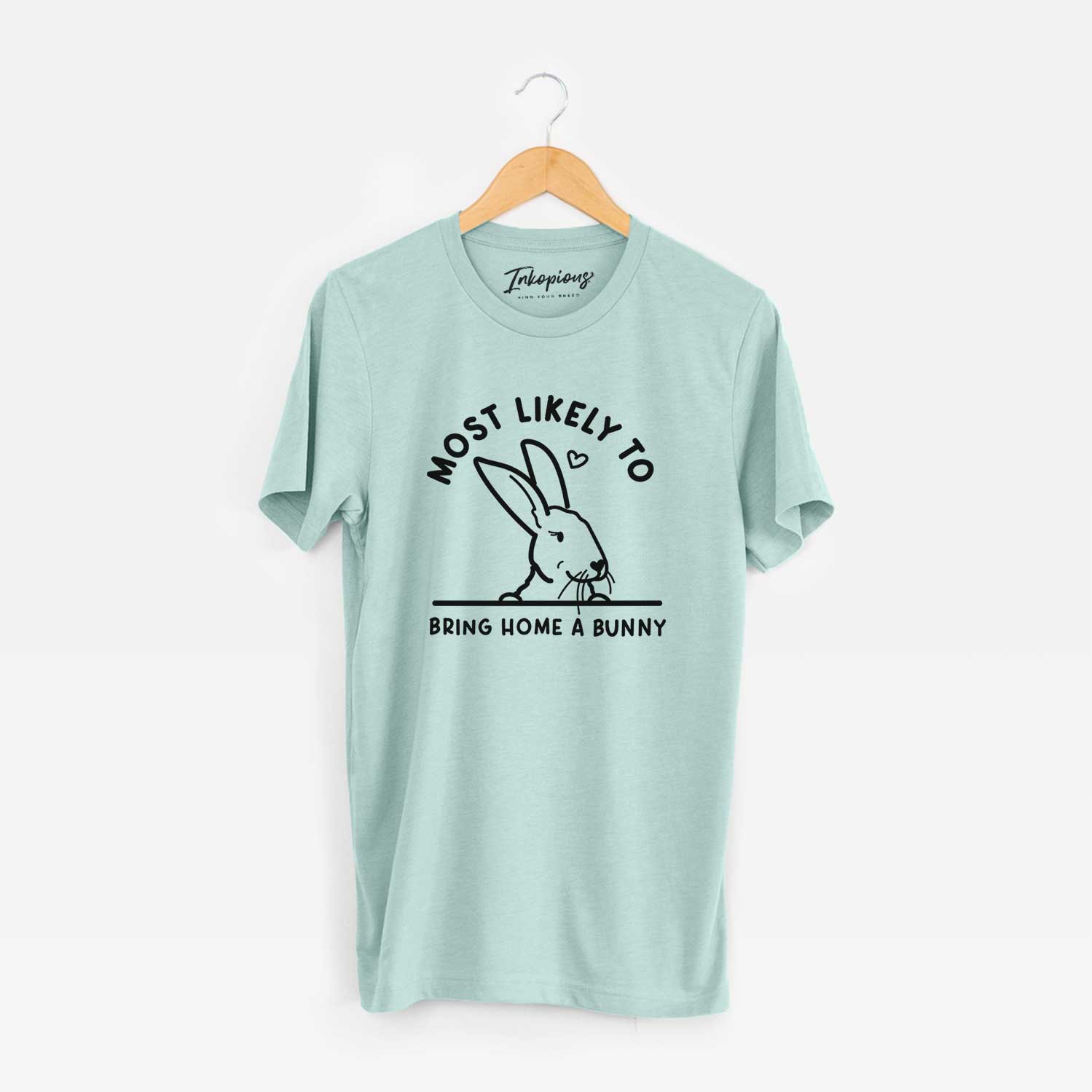 'Most Likely to Bring Home a Bunny' design on a Heather Sage Unisex crewneck