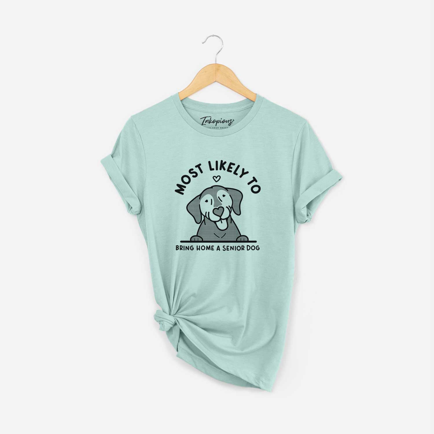 'Most Likely to Bring Home a Senior Dog' design on a Heather Sage Unisex crewneck