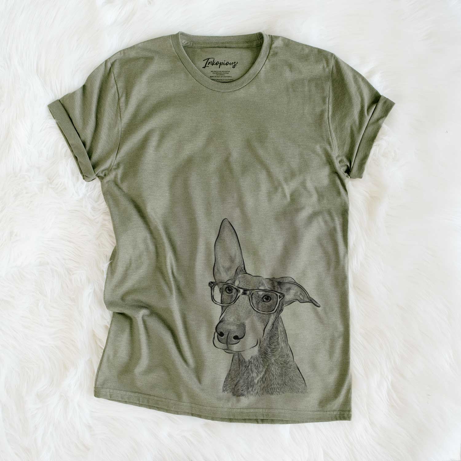 Hand-drawn sketch of Kain the Doberman Pinscher on an Olive Unisex crewneck