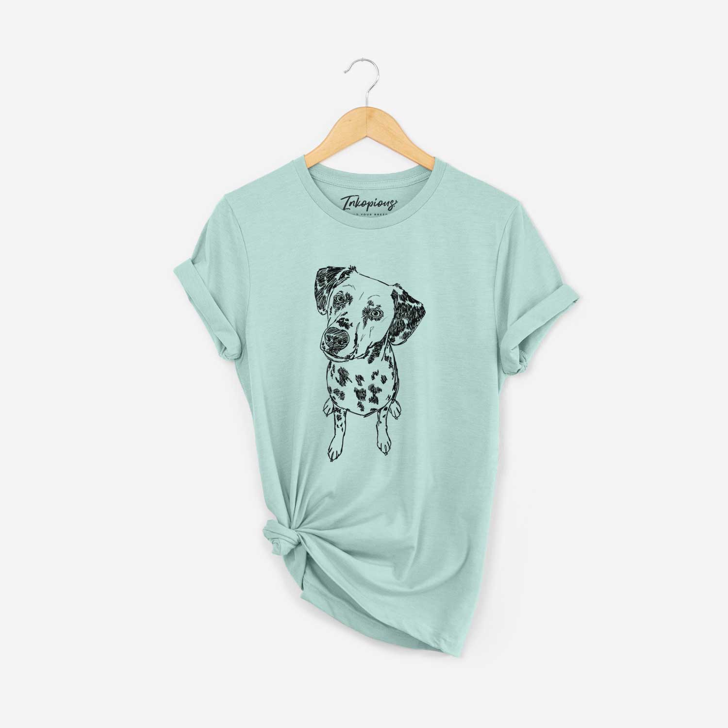 Full-body line drawing of Daisy Mae the Dalmatian on a Heather Sage Unisex crewneck
