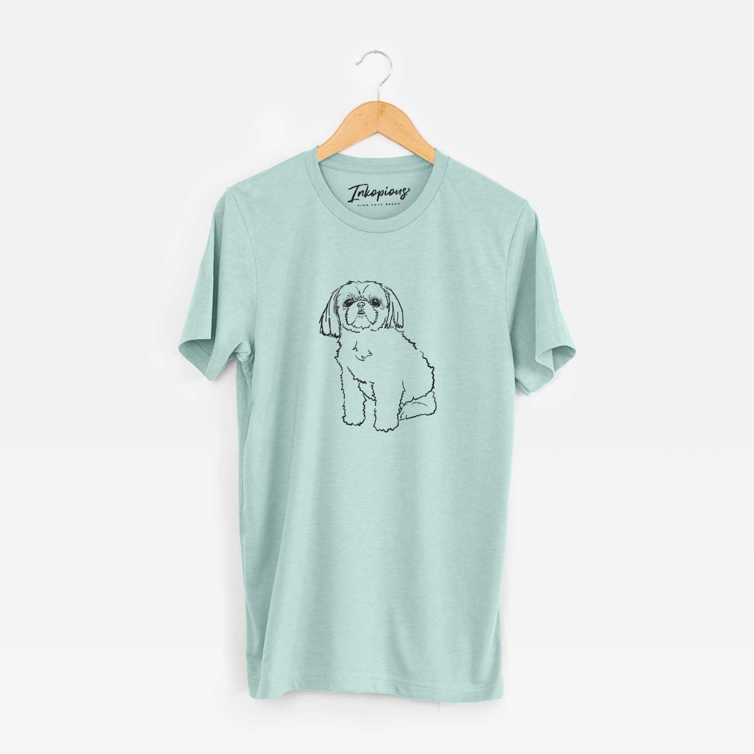 Full-body line drawing of Georgia the Shih Tzu on a Heather Sage Unisex crewneck