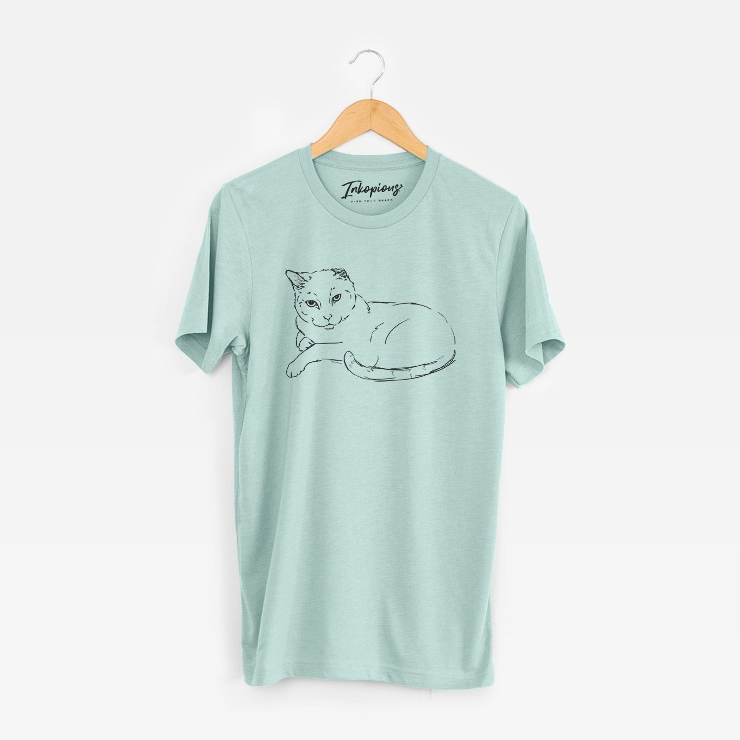 Full-body line drawing of Spenser the Cat on a Heather Sage Unisex crewneck