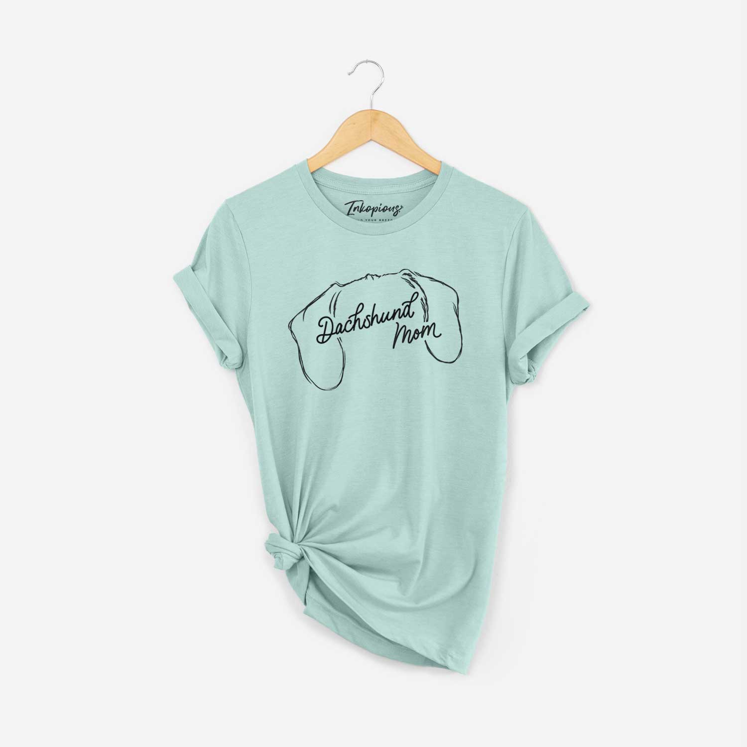 'Dachshund Mom' design on a Heather Sage Unisex crewneck