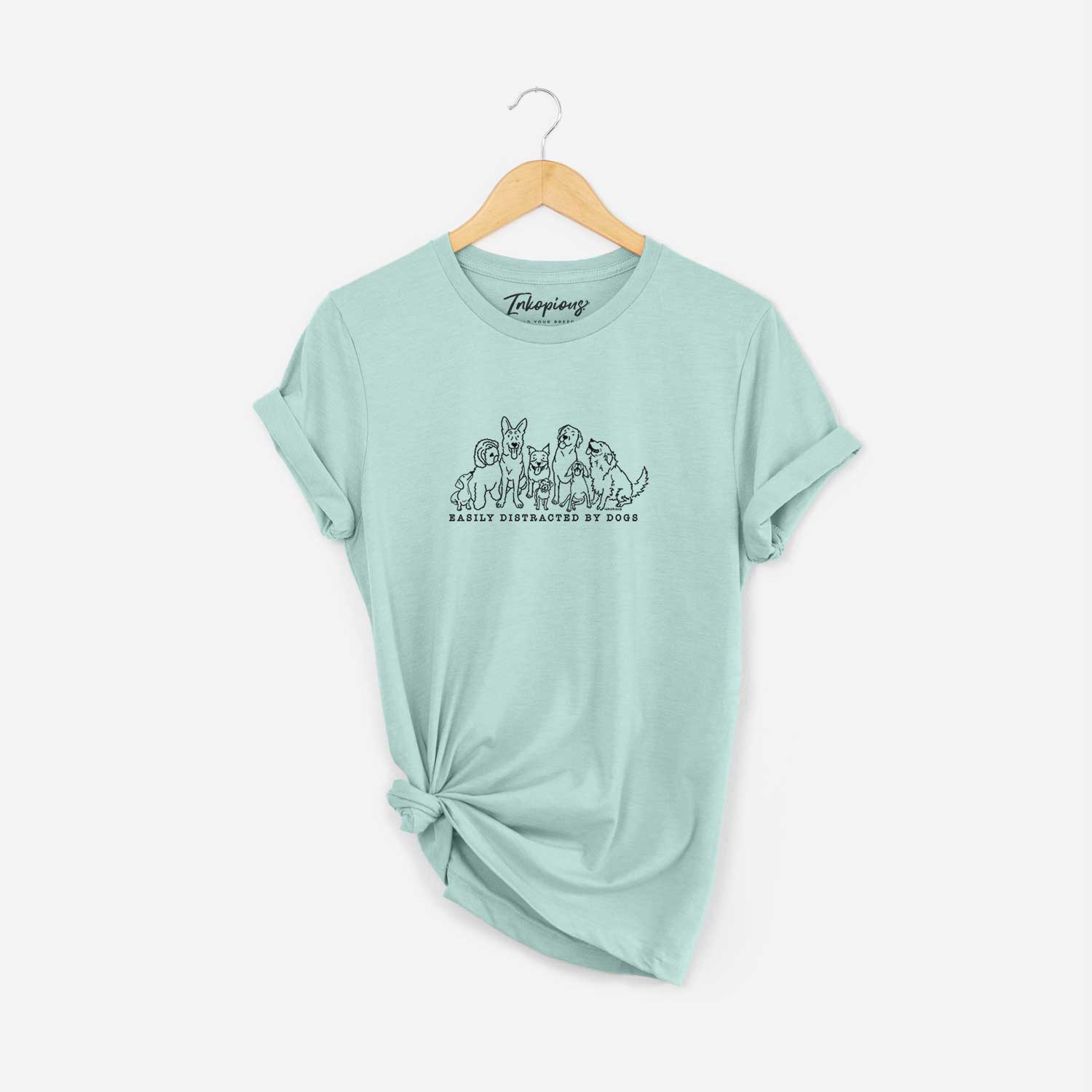'Distracted by Dogs' design on a Heather Sage Unisex crewneck