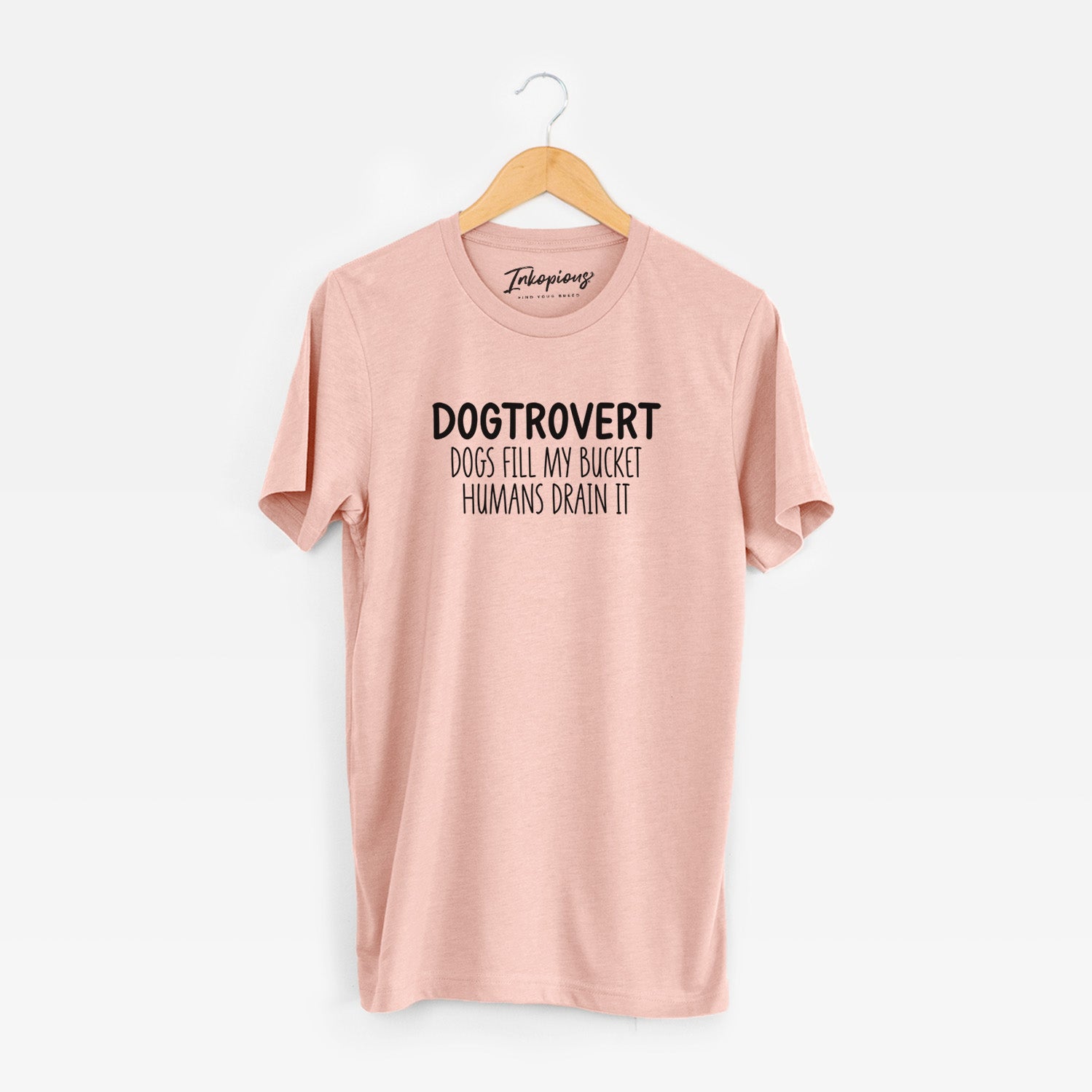 'Dogtrovert - Dogs Fill My Bucket Humans Drain It' design on a Peach Unisex crewneck