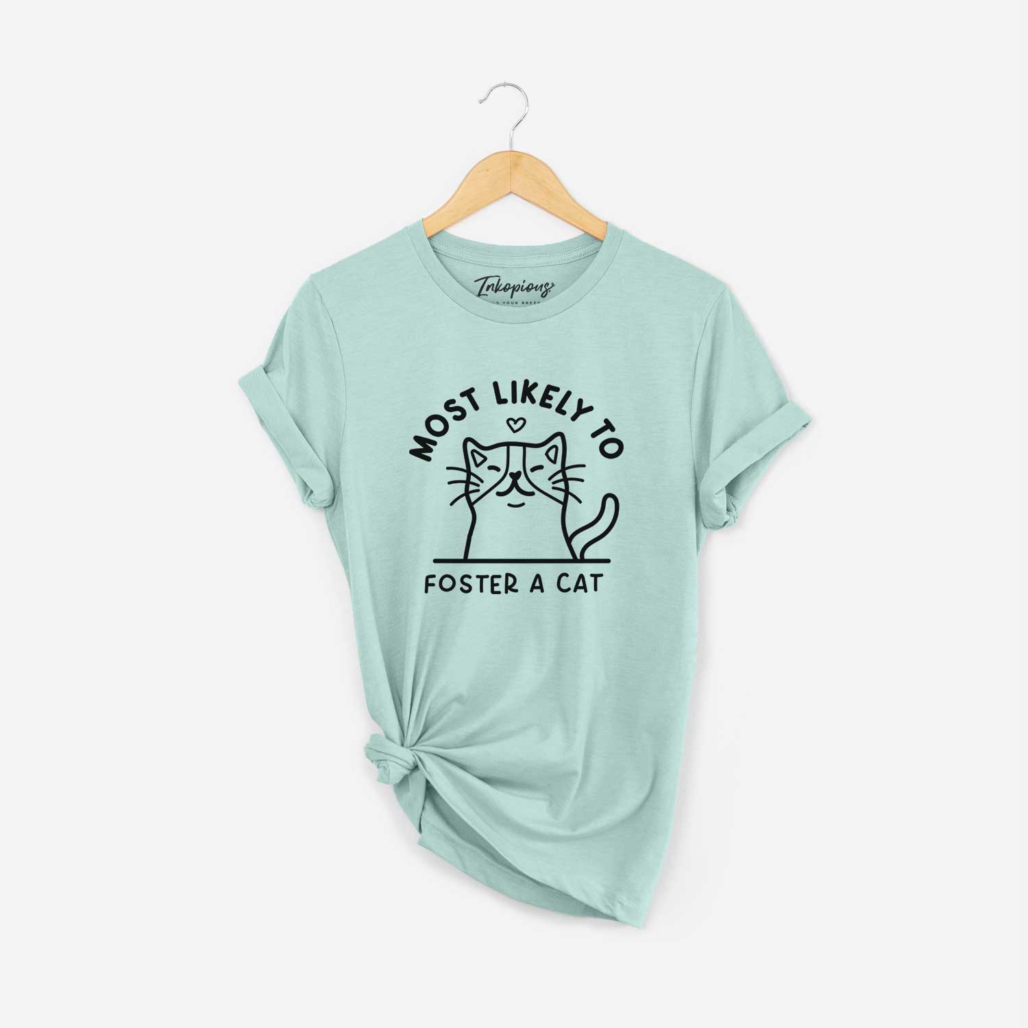 'Most Likely to Foster a Cat' design on a Heather Sage Unisex crewneck