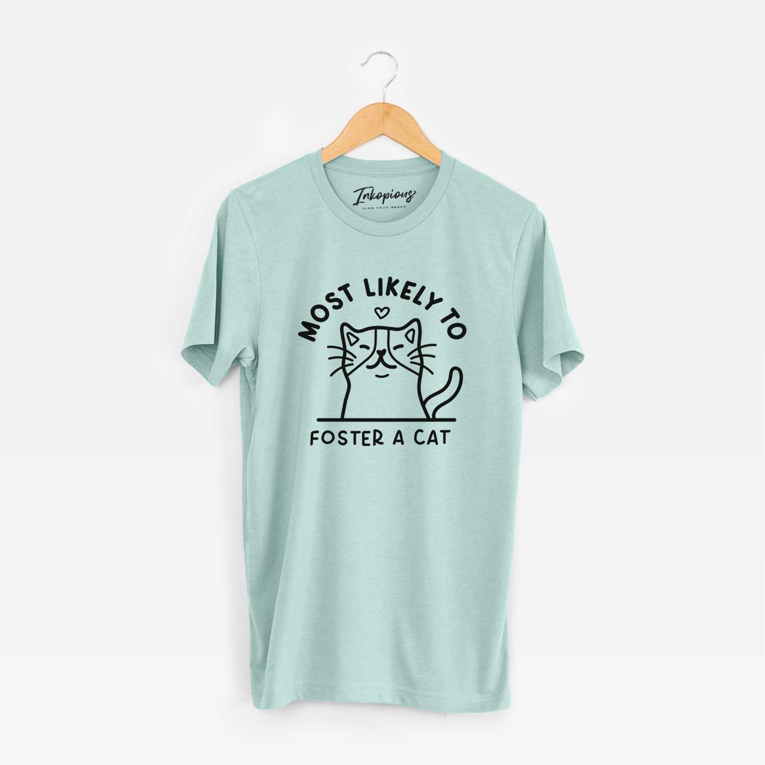 'Most Likely to Foster a Cat' design on a Heather Sage Unisex crewneck
