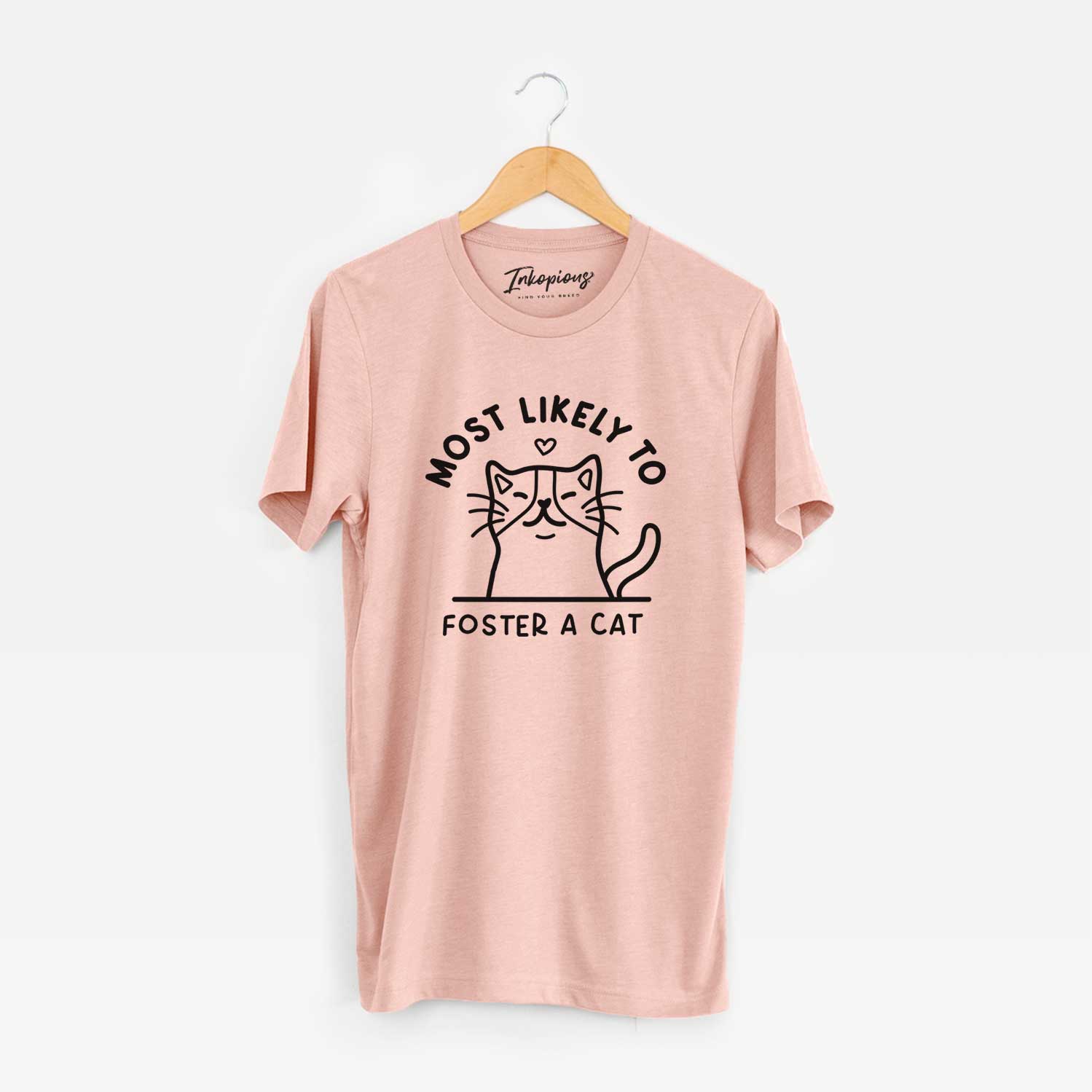 'Most Likely to Foster a Cat' design on a Peach Unisex crewneck