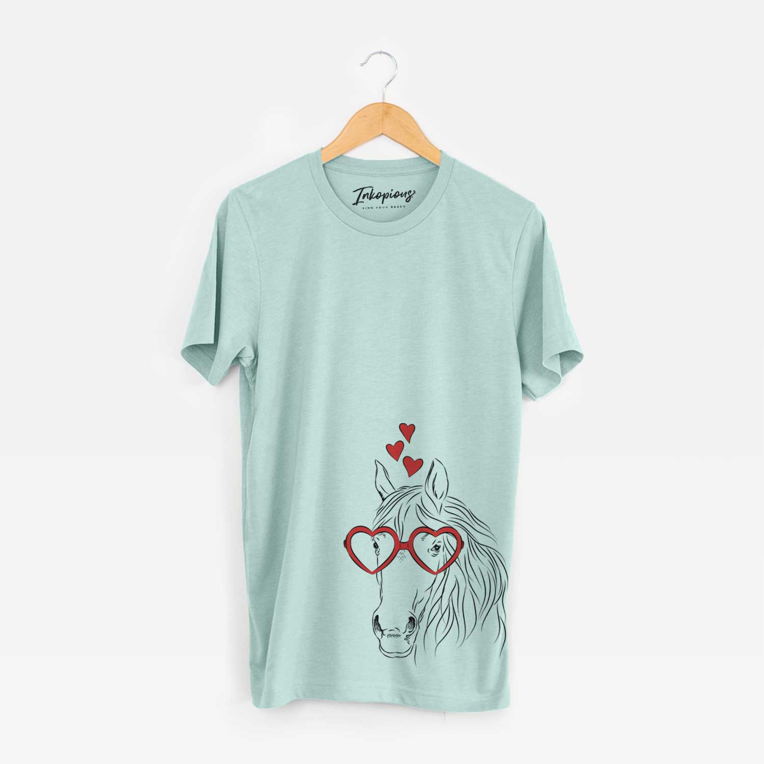 Hand-drawn sketch of Aria the Horse wearing heart-shaped glasses on a Heather Sage Bella Canvas Unisex Crewneck