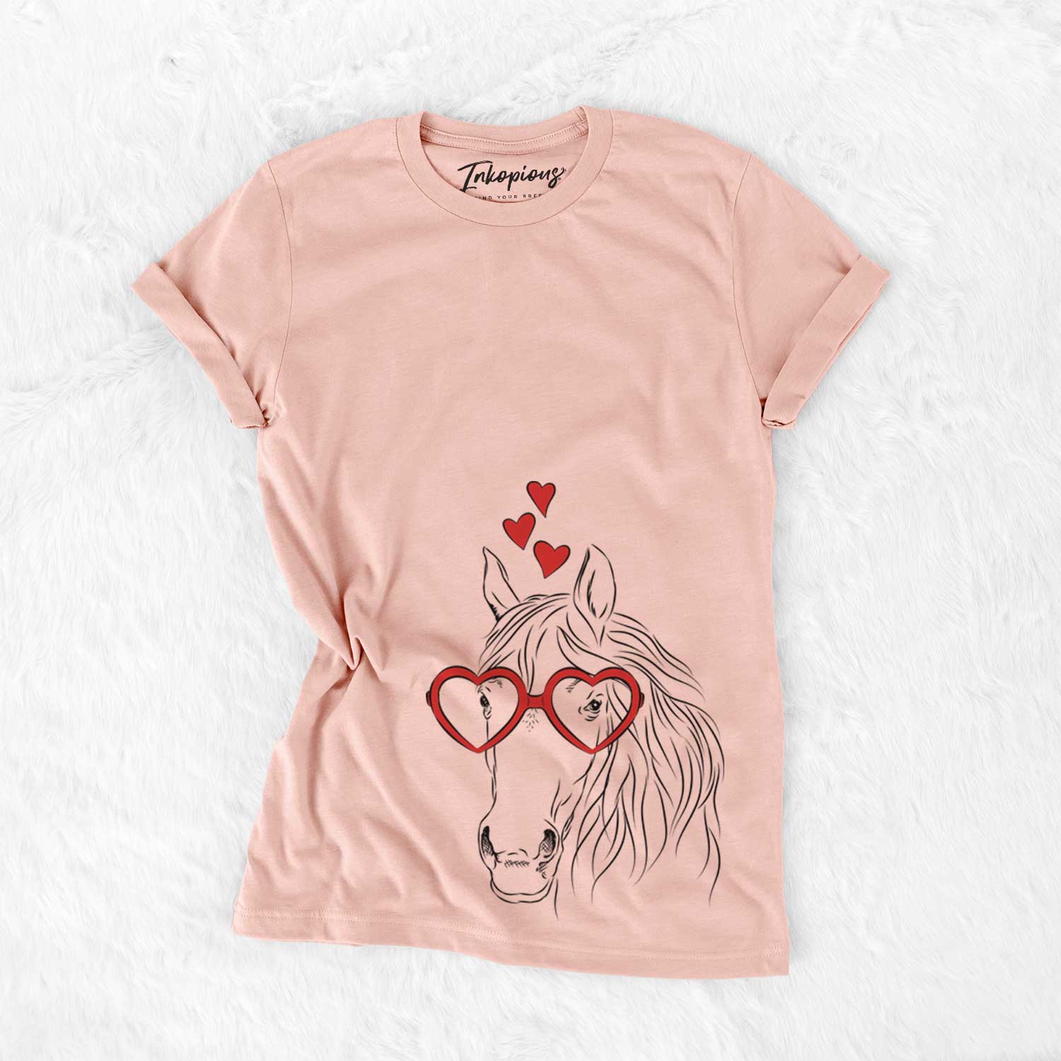Hand-drawn sketch of Aria the Horse wearing heart-shaped glasses on a Peach Bella Canvas Unisex Crewneck