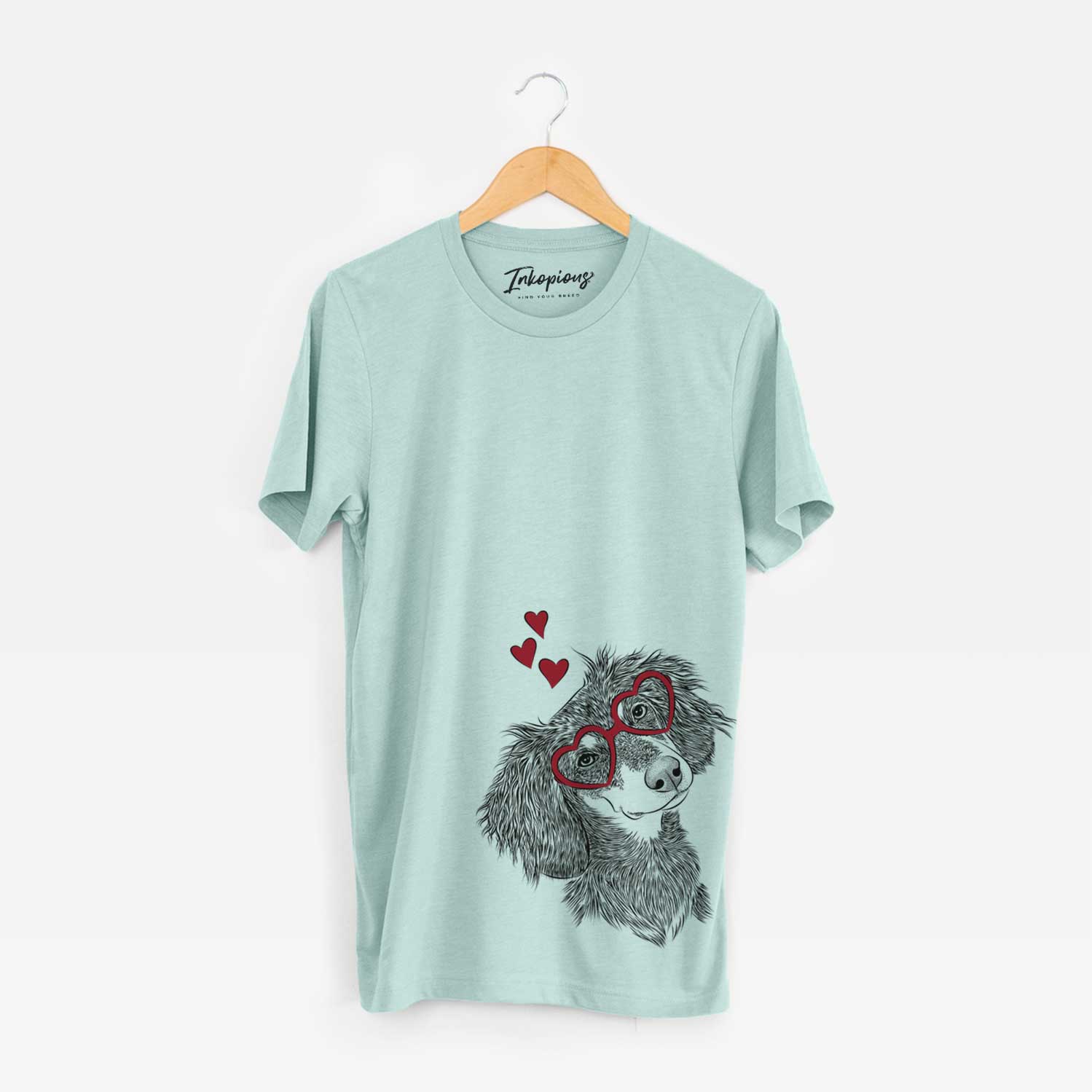 Hand-drawn sketch of Bailey the Long Haired Dachshund wearing heart-shaped glasses on a Heather Sage Bella Canvas Unisex Crewneck