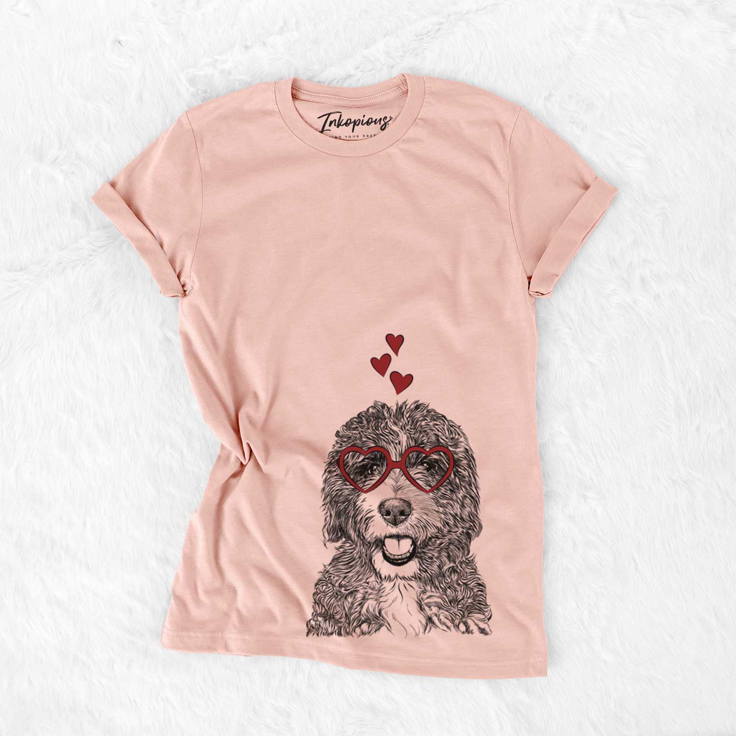 Hand-drawn sketch of Bash the Bernedoodle wearing heart-shaped glasses on a Peach Bella Canvas Unisex Crewneck