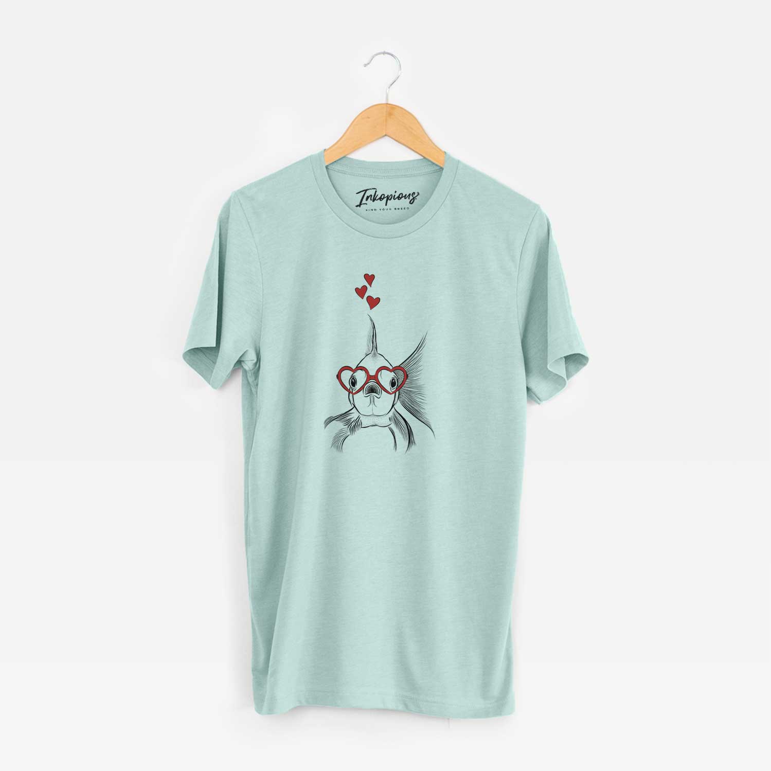 Hand-drawn sketch of Beefcake the Goldfish wearing heart-shaped glasses on a Heather Sage Unisex crewneck