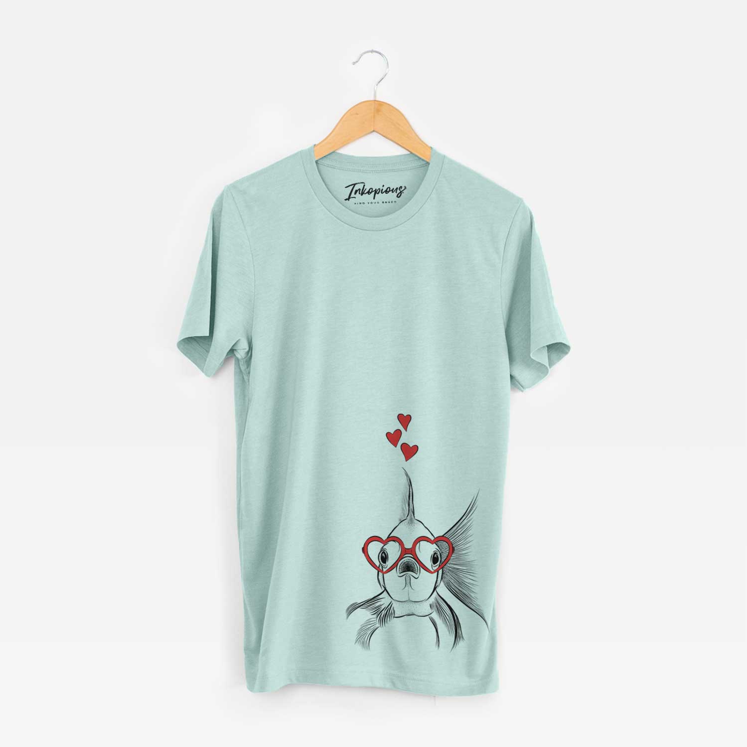 Hand-drawn sketch of Beefcake the Goldfish wearing heart-shaped glasses on a Heather Sage Unisex crewneck