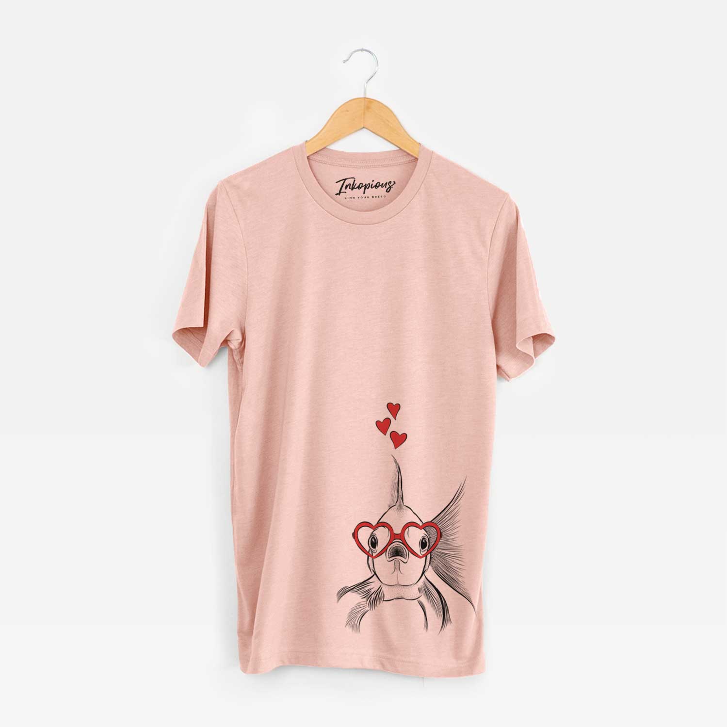 Hand-drawn sketch of Beefcake the Goldfish wearing heart-shaped glasses on a Peach Unisex crewneck