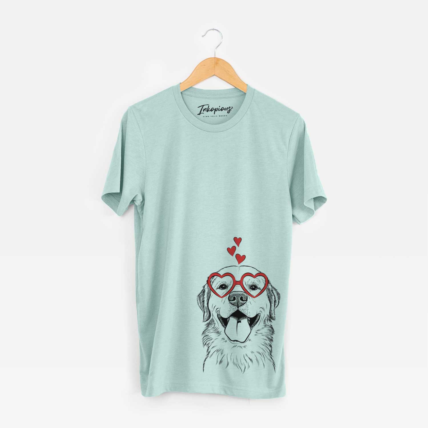 Hand-drawn sketch of Bennett the Golden Retriever wearing heart-shaped glasses on a Heather Sage Unisex crewneck