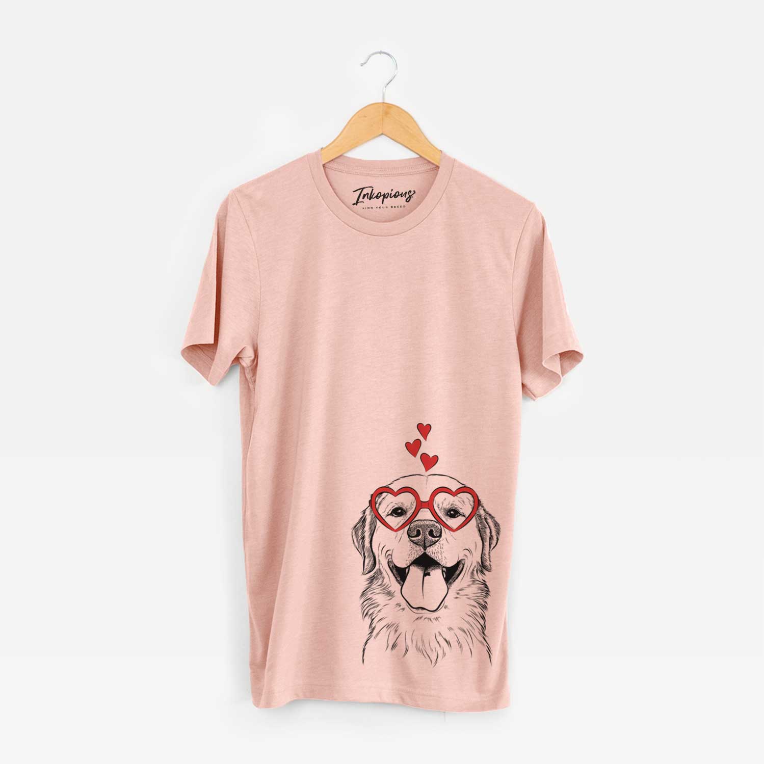Hand-drawn sketch of Bennett the Golden Retriever wearing heart-shaped glasses on a Peach Unisex crewneck