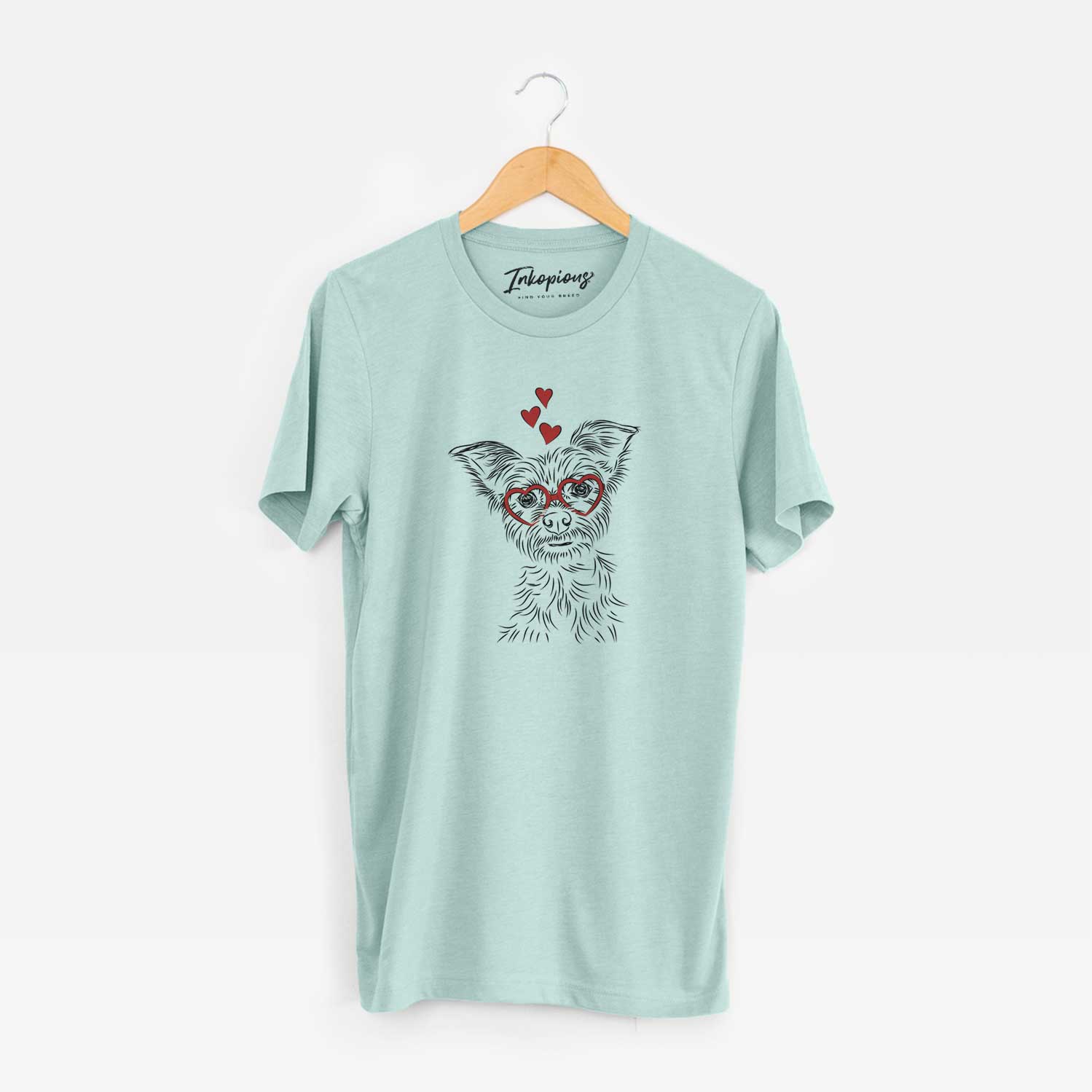 Hand-drawn sketch of Bingo the Yorkshire Terrier wearing heart-shaped glasses on a Heather Sage Unisex crewneck