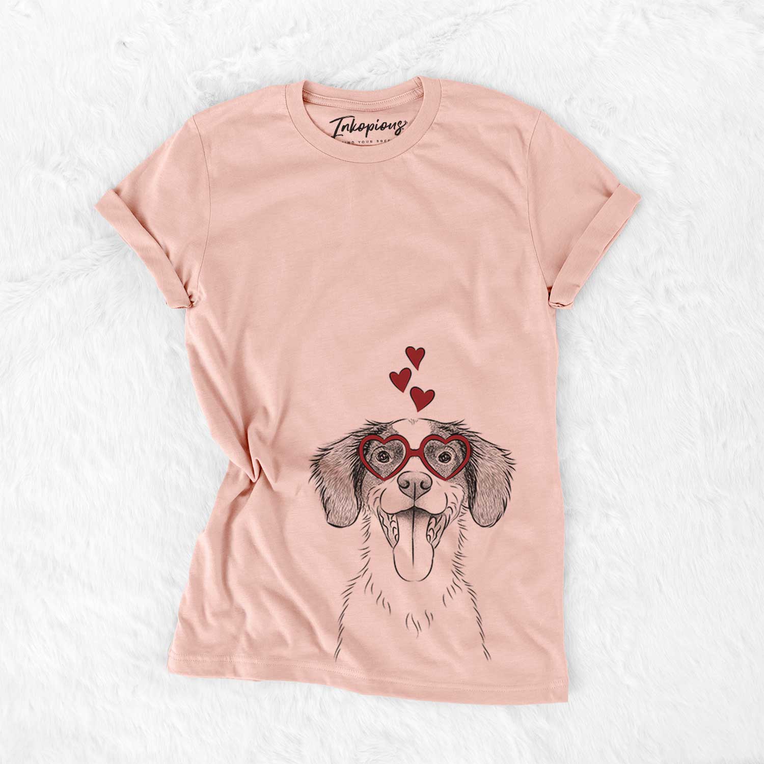 Hand-drawn sketch of Birdie the Brittany wearing heart-shaped glasses on a Peach Bella Canvas Unisex Crewneck