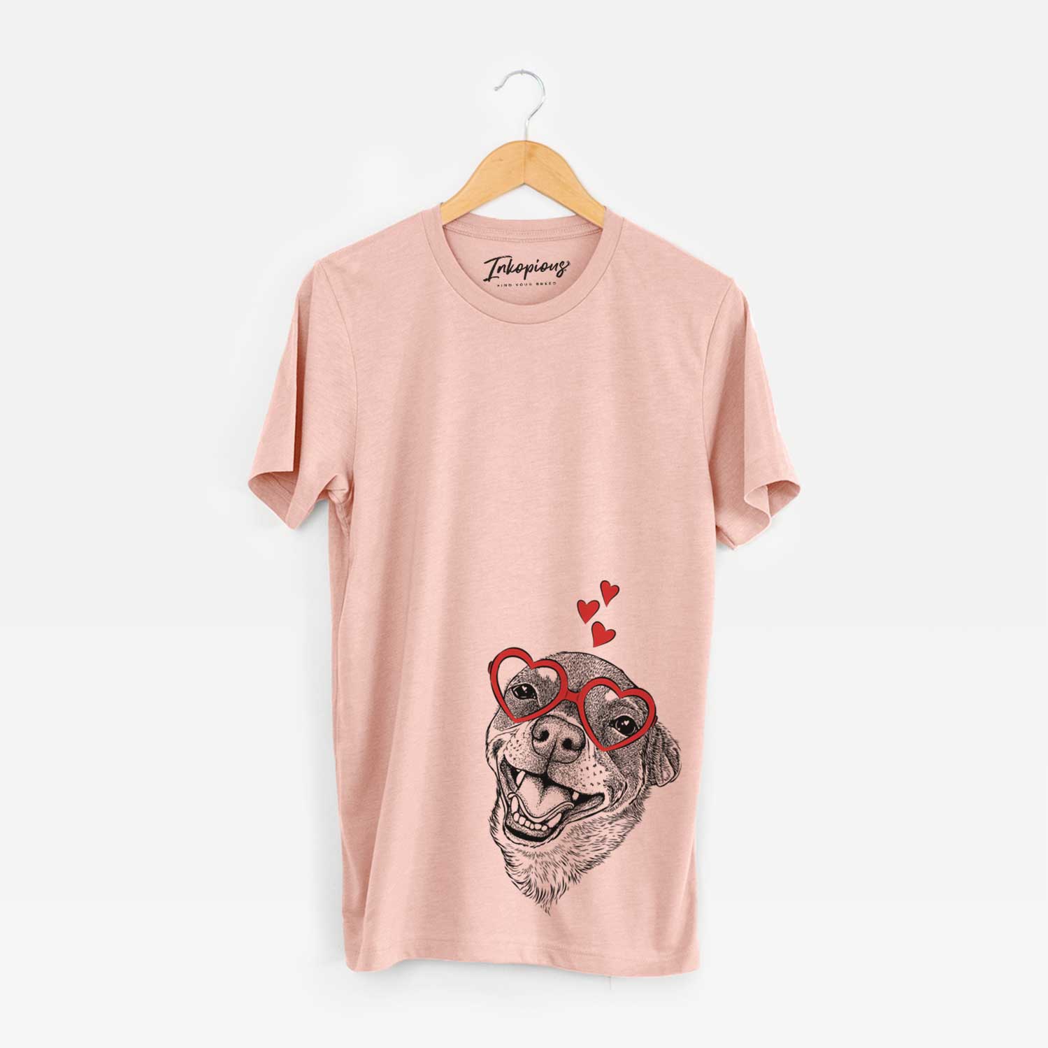 Hand-drawn sketch of Boss the Chihuahua wearing heart-shaped glasses on a Peach Unisex crewneck