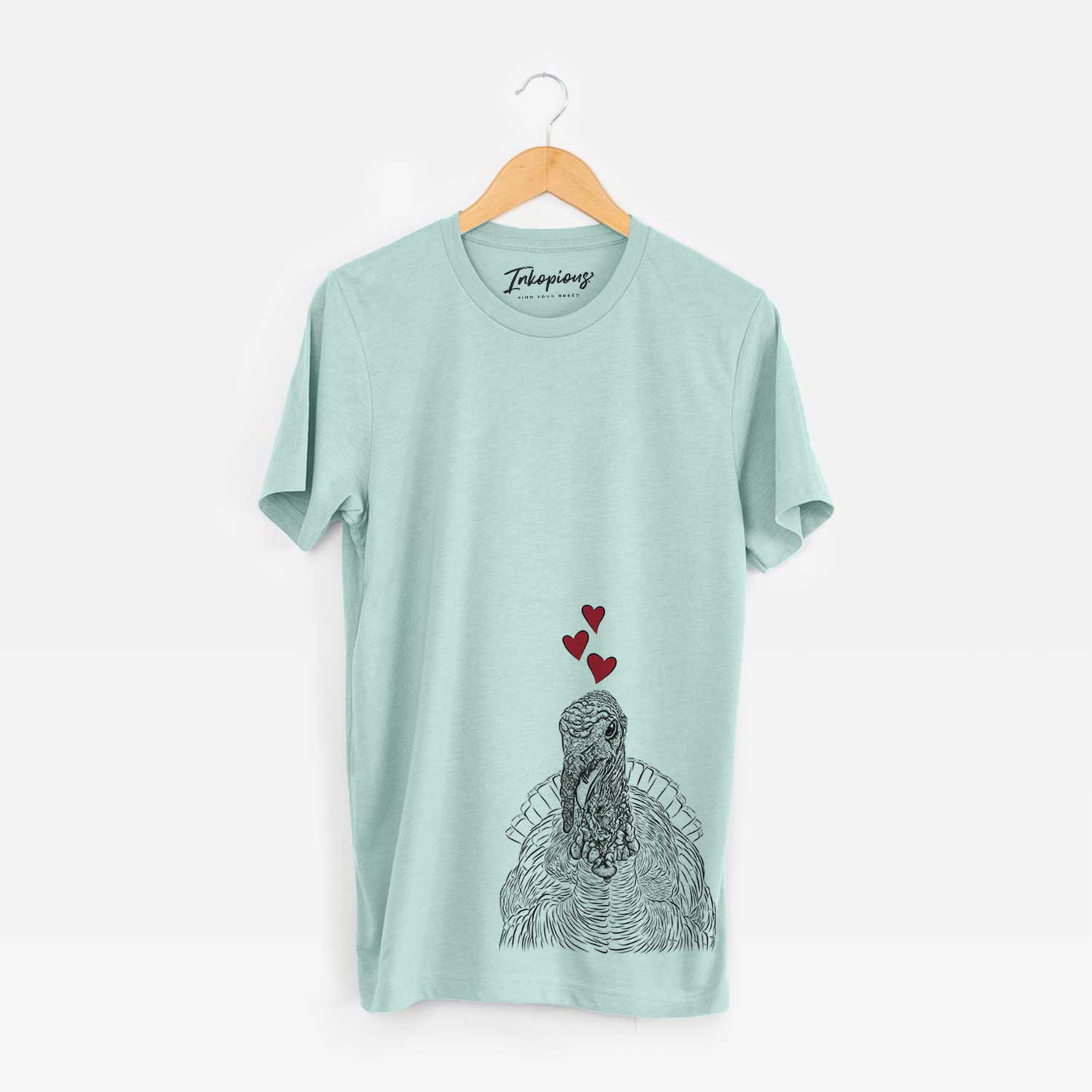 Hand-drawn sketch of Brady the Turkey wearing heart-shaped glasses on a Heather Sage Bella Canvas Unisex Crewneck