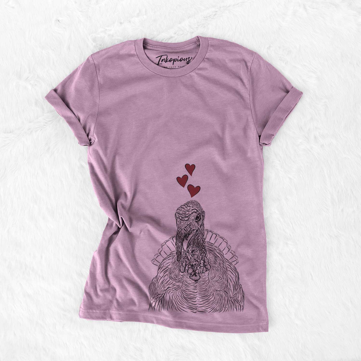 Hand-drawn sketch of Brady the Turkey wearing heart-shaped glasses on an Orchid Bella Canvas Unisex Crewneck
