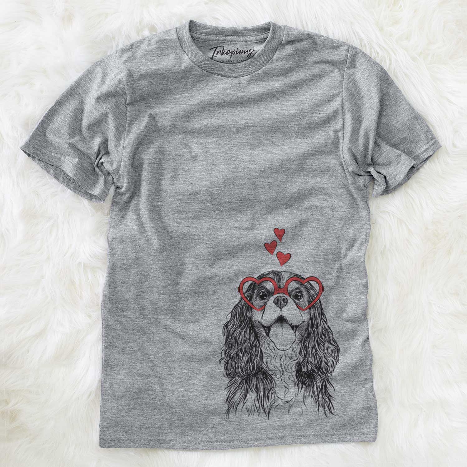 Hand-drawn sketch of Brandy the Cavalier King Charles Spaniel wearing heart-shaped glasses on a Grey Unisex crewneck