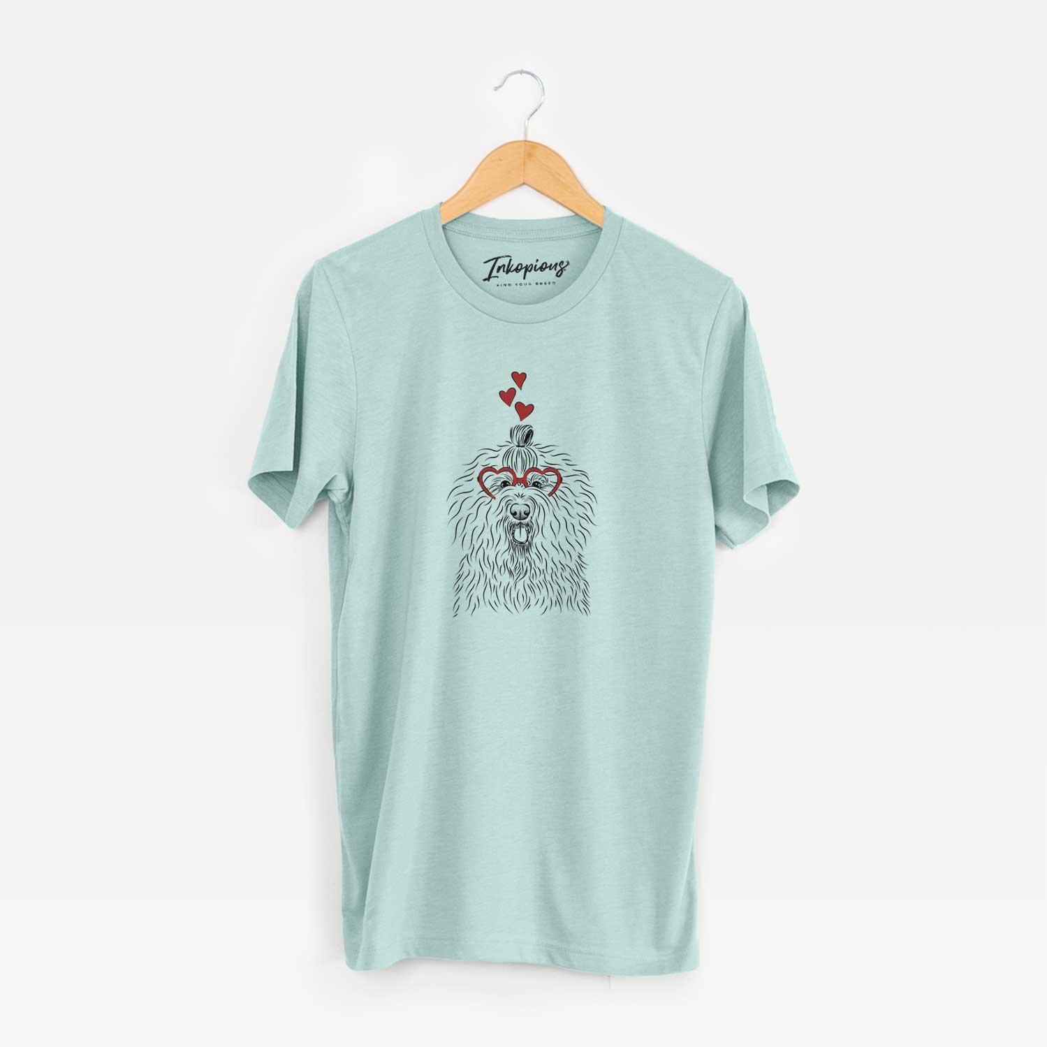 Hand-drawn sketch of Brody the Old English Sheepdog wearing heart-shaped glasses on a Heather Sage Unisex crewneck