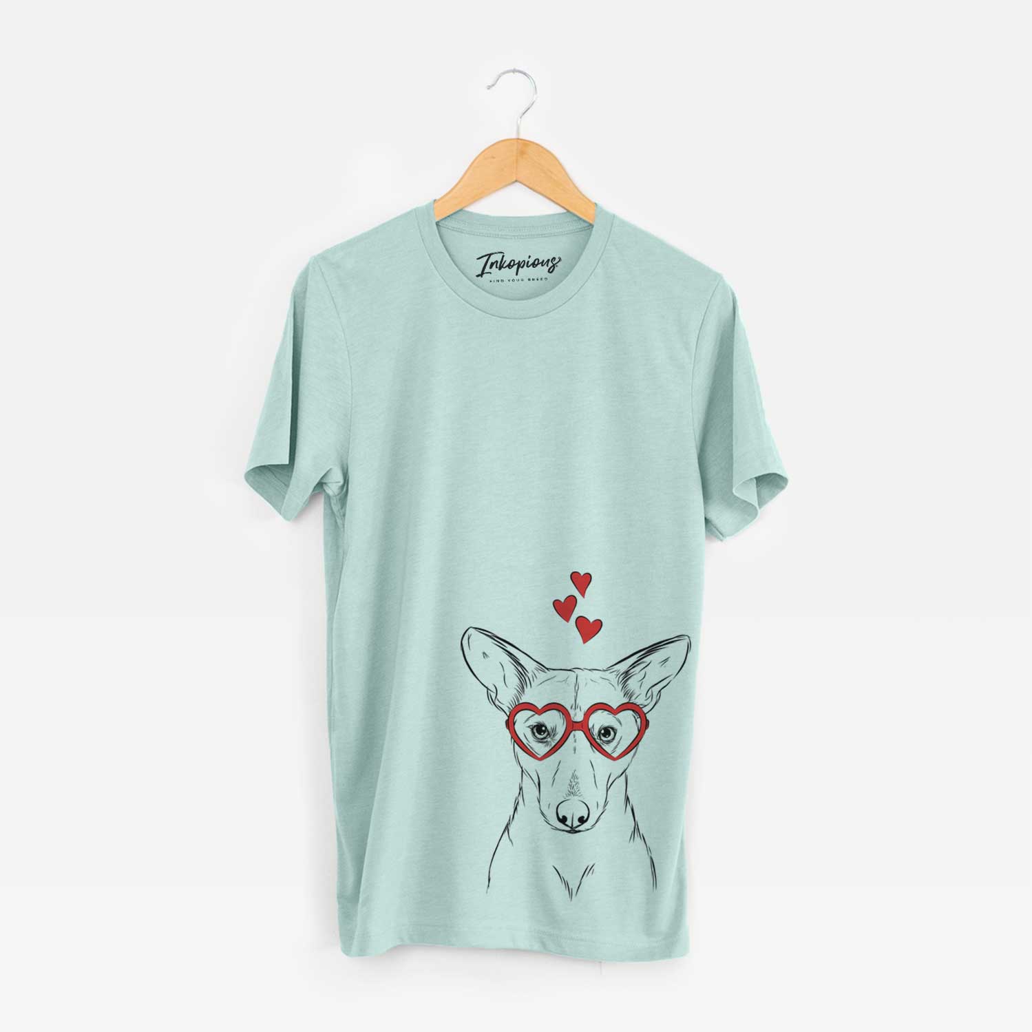 Hand-drawn sketch of Buff the Dorgi wearing heart-shaped glasses on a Heather Sage Unisex crewneck