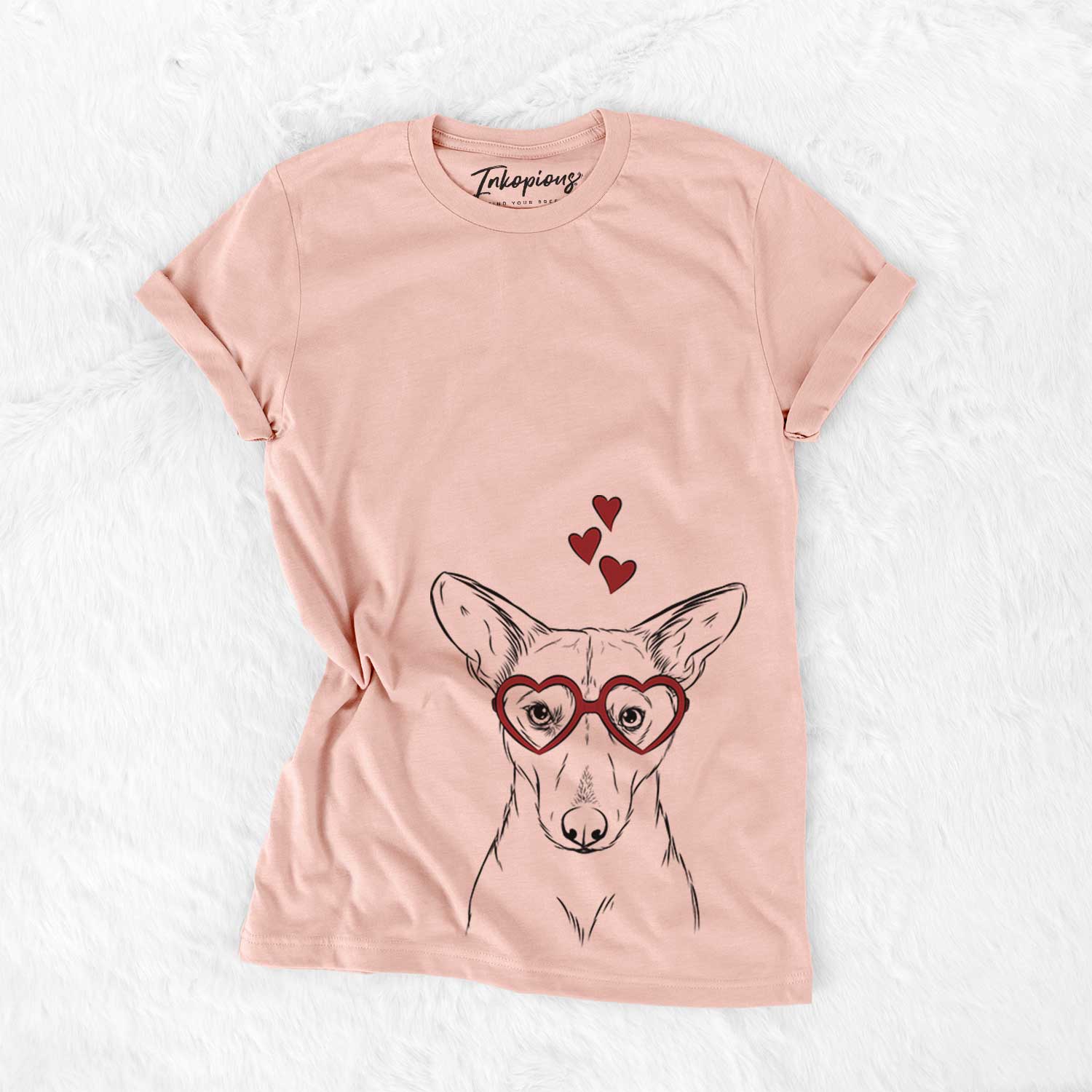 Hand-drawn sketch of Buff the Dorgi wearing heart-shaped glasses on a Peach Bella Canvas Unisex Crewneck