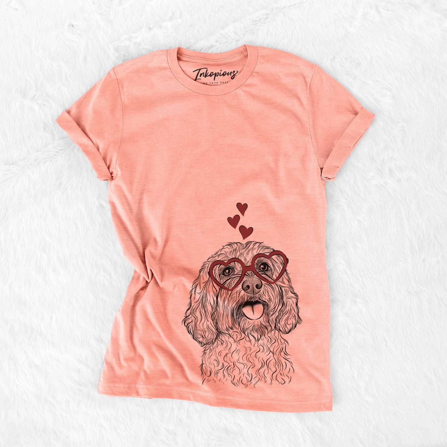 Hand-drawn sketch of Cali the Cavapoo wearing heart-shaped glasses on a Sunset Bella Canvas Unisex Crewneck