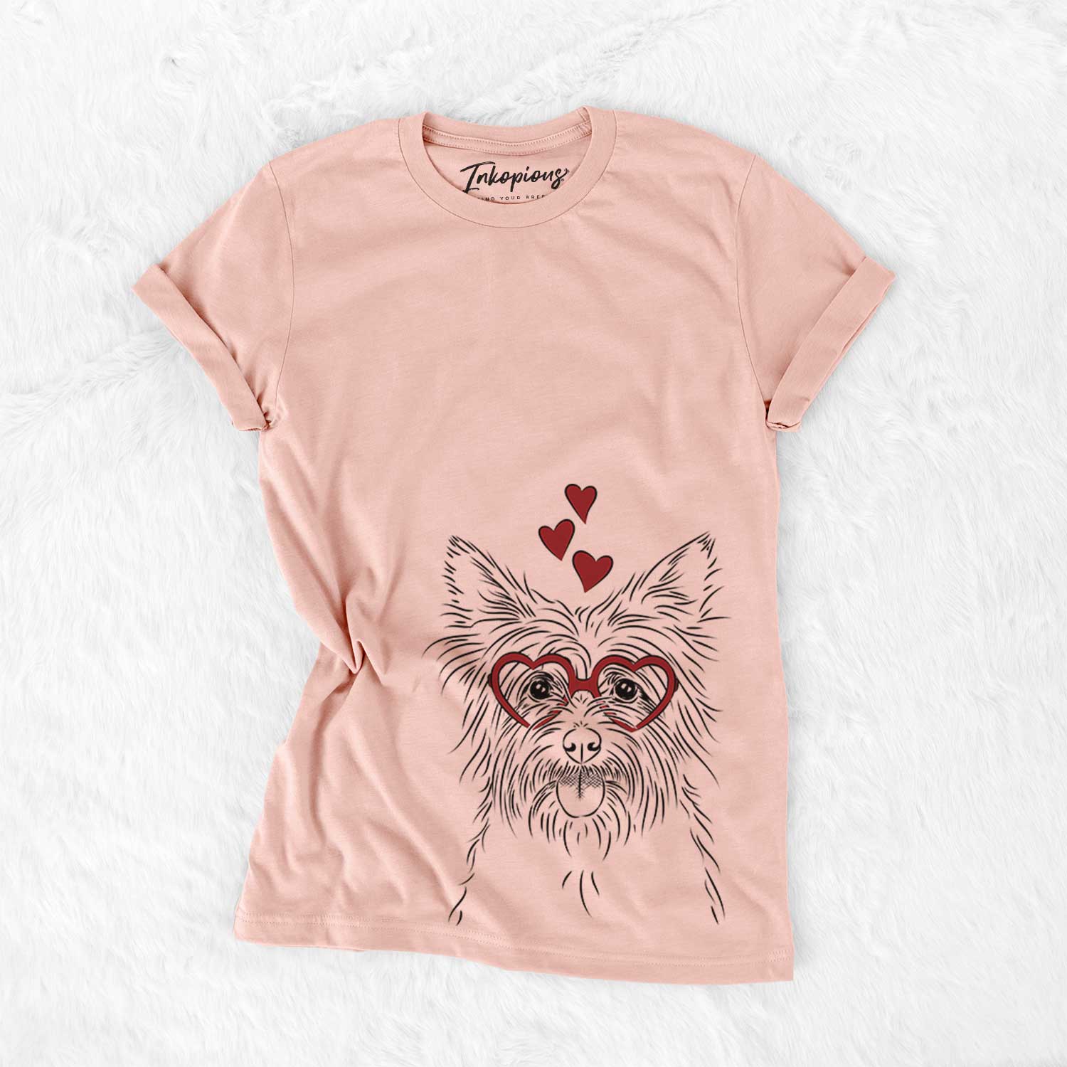 Hand-drawn sketch of Calum the Cairn Terrier wearing heart-shaped glasses on a Peach Bella Canvas Unisex Crewneck