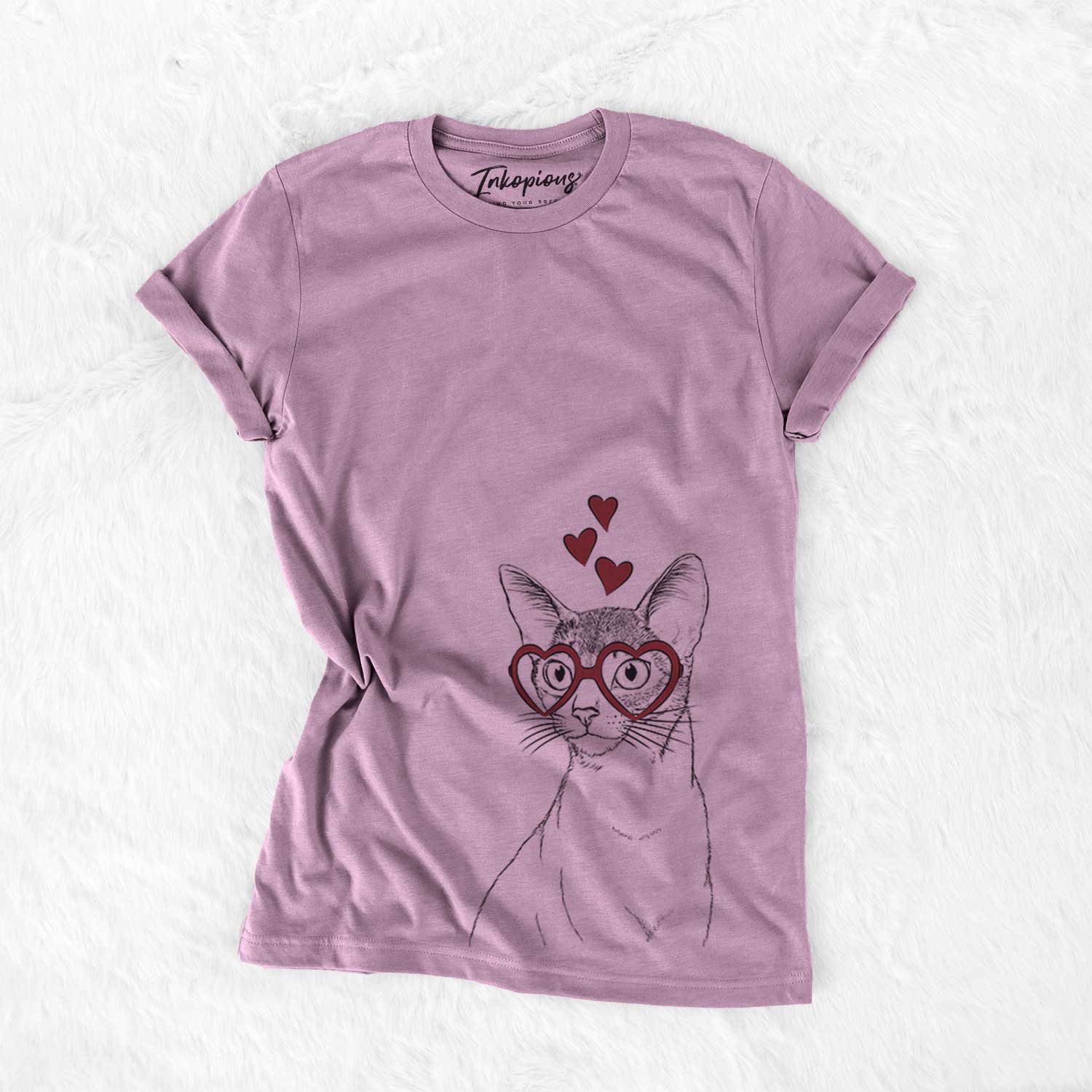 Hand-drawn sketch of Cedric the Abyssinian Cat wearing heart-shaped glasses on an Orchid Bella Canvas Unisex Crewneck
