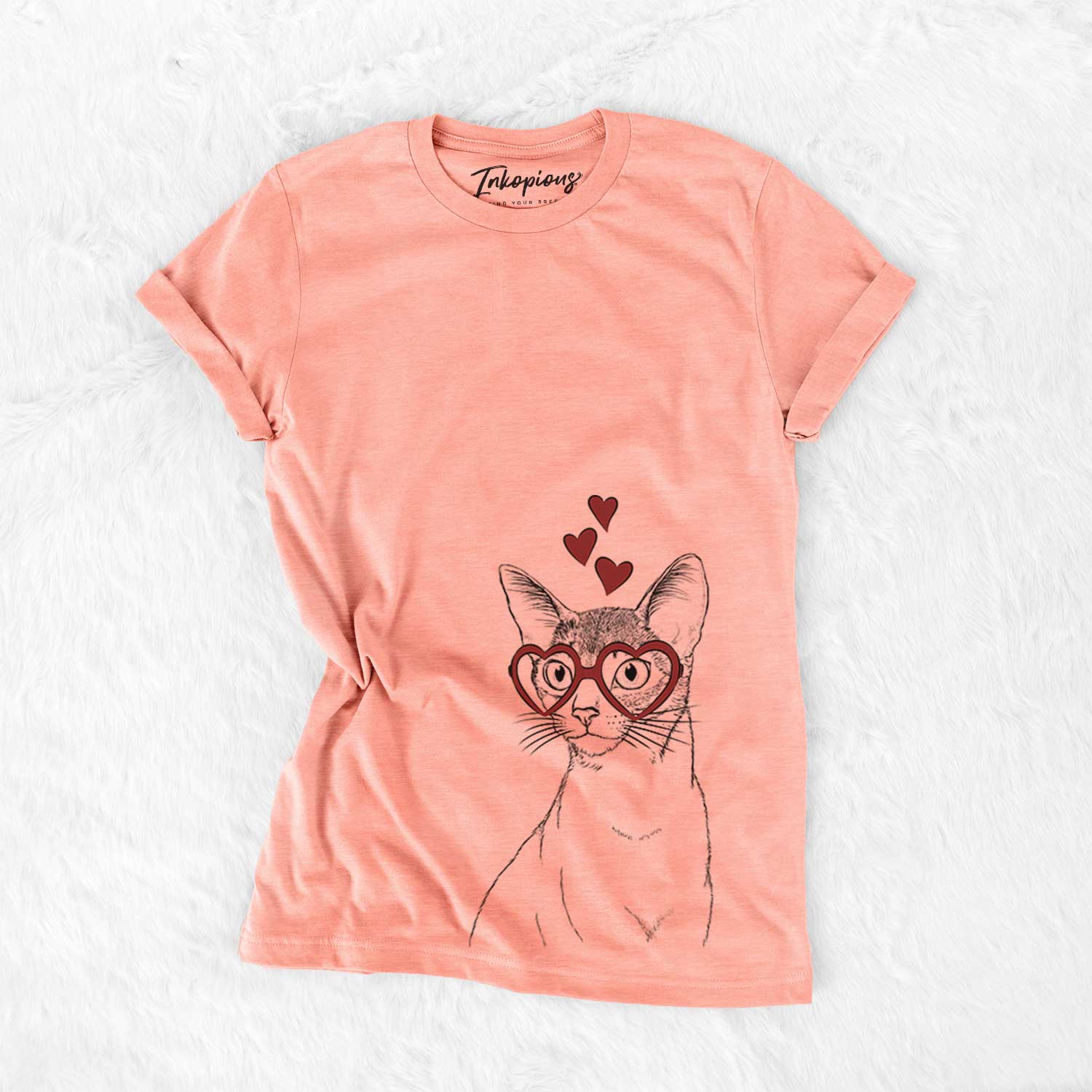Hand-drawn sketch of Cedric the Abyssinian Cat wearing heart-shaped glasses on a Sunset Bella Canvas Unisex Crewneck