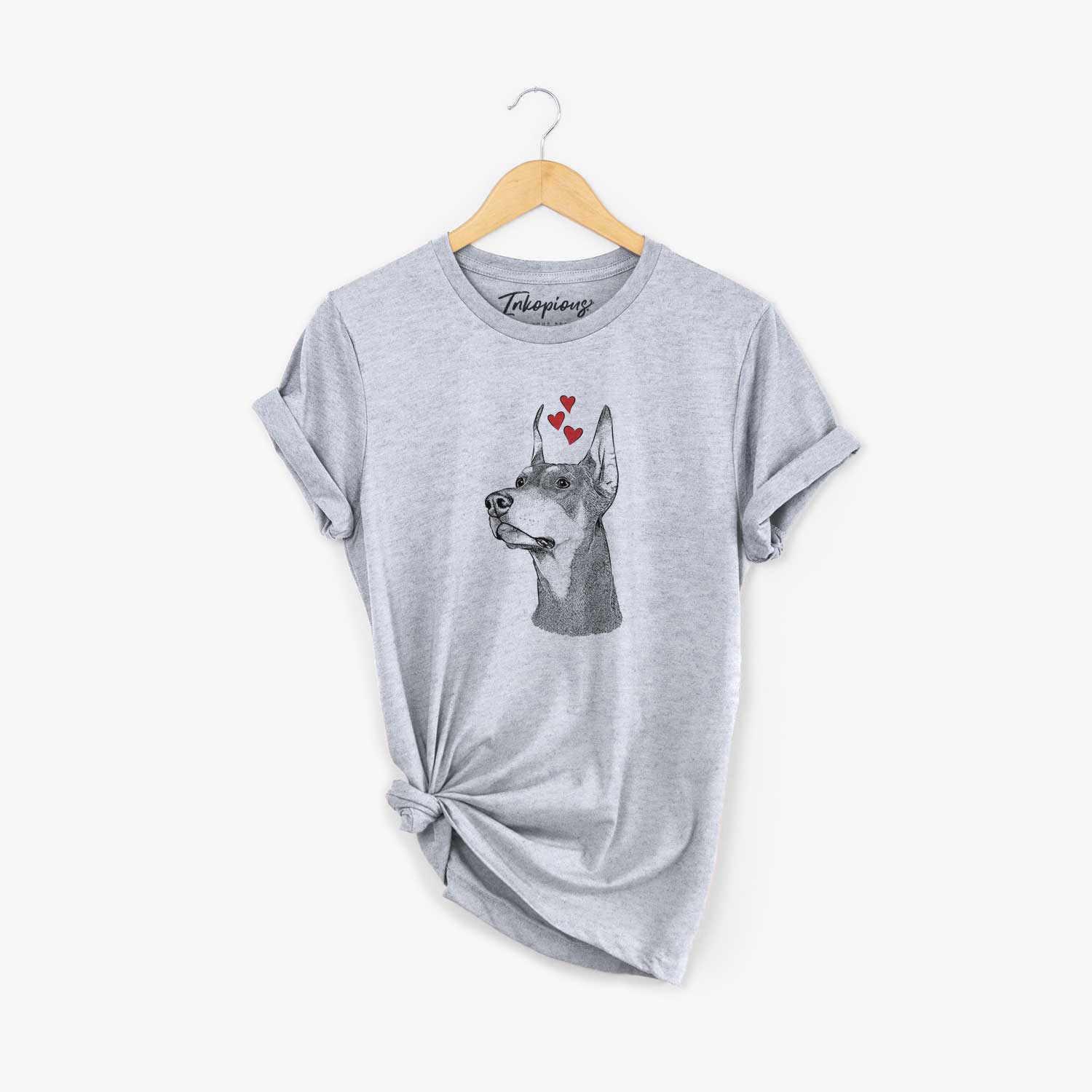 Hand-drawn sketch of Cenza the Doberman Pinscher wearing heart-shaped glasses on a Grey Unisex crewneck