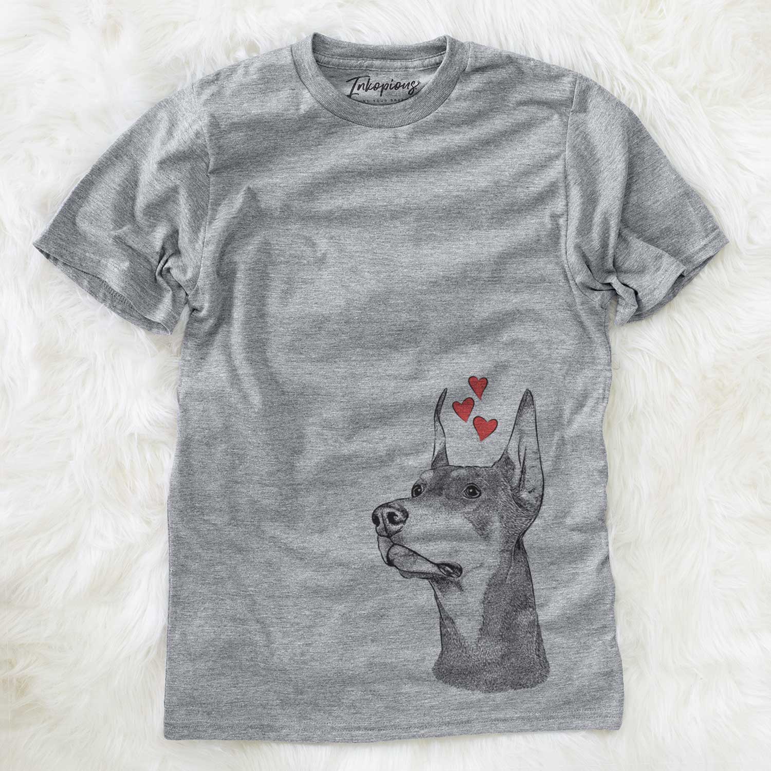 Hand-drawn sketch of Cenza the Doberman Pinscher wearing heart-shaped glasses on a Grey Unisex crewneck