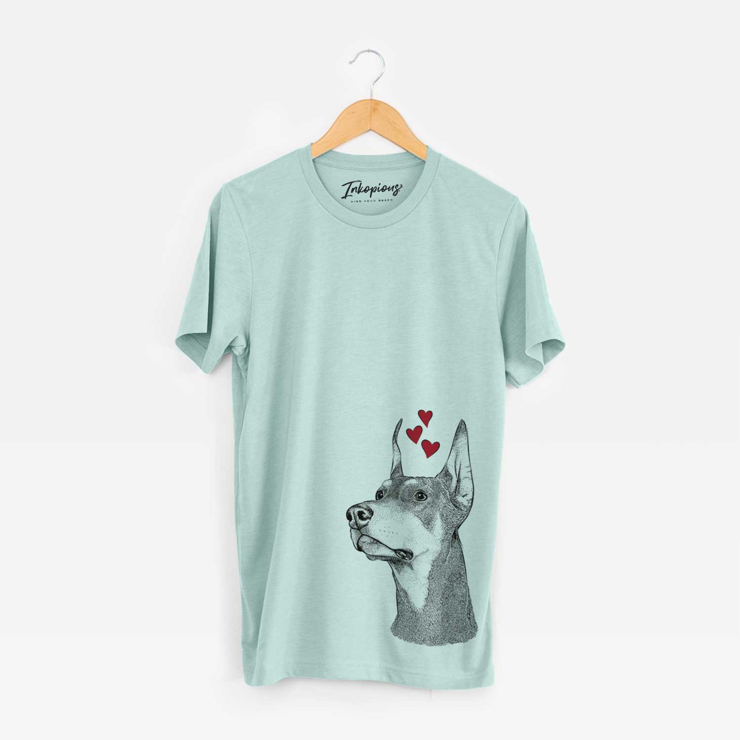 Hand-drawn sketch of Cenza the Doberman Pinscher wearing heart-shaped glasses on a Heather Sage Bella Canvas Unisex Crewneck