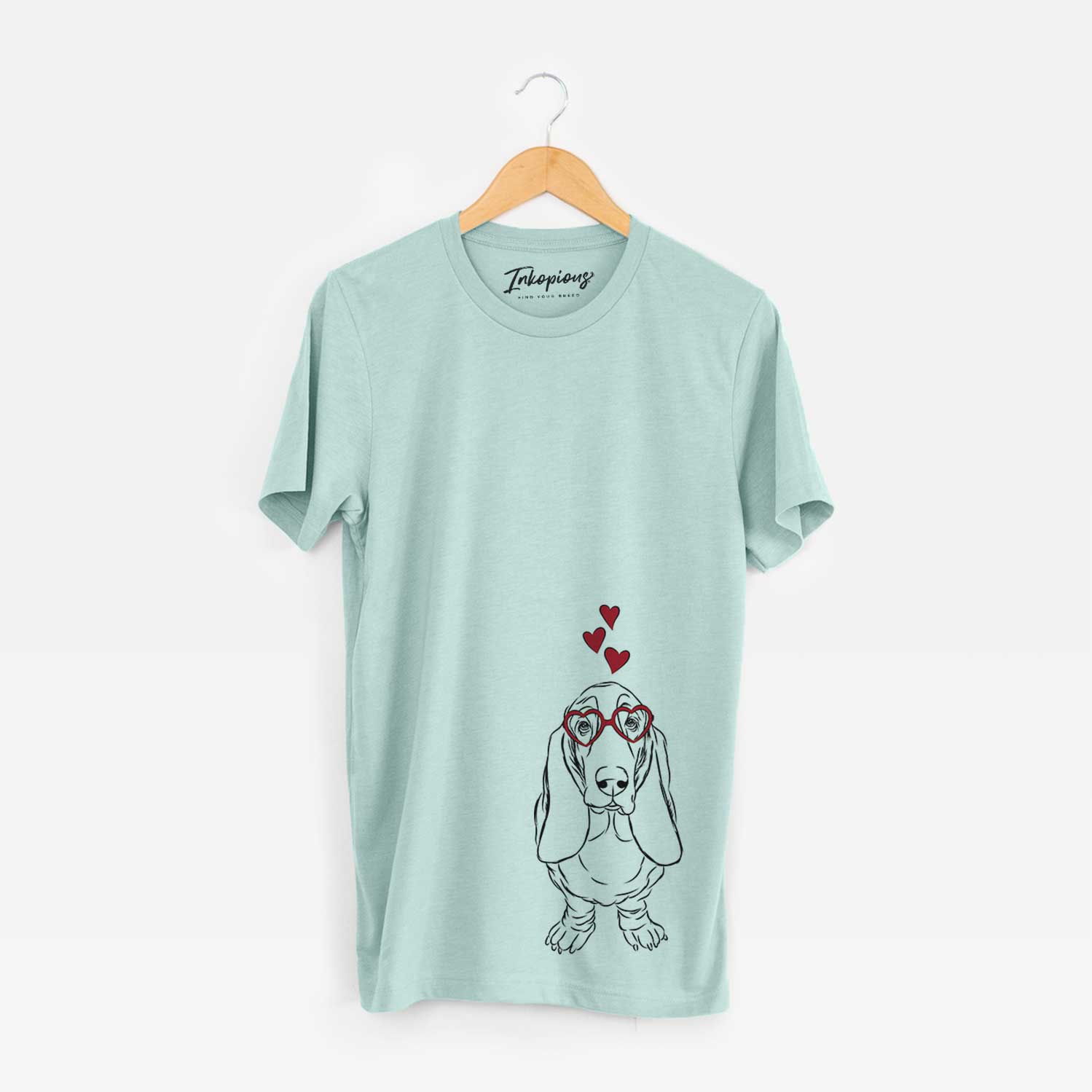 Hand-drawn sketch of Charlie the Basset Hound wearing heart-shaped glasses on a Heather Sage Bella Canvas Unisex Crewneck