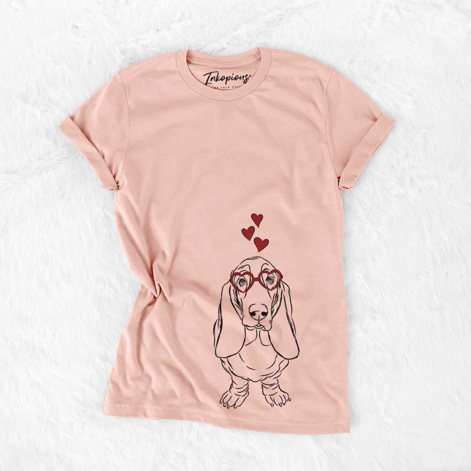 Hand-drawn sketch of Charlie the Basset Hound wearing heart-shaped glasses on a Peach Bella Canvas Unisex Crewneck