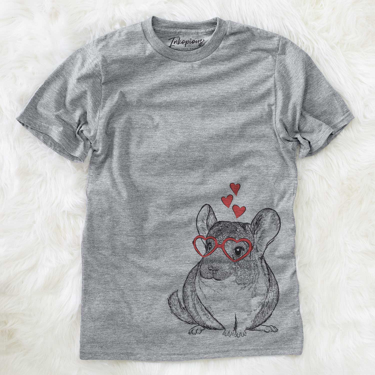 Hand-drawn sketch of Cheddar the Chinchilla wearing heart-shaped glasses on a Grey Unisex crewneck