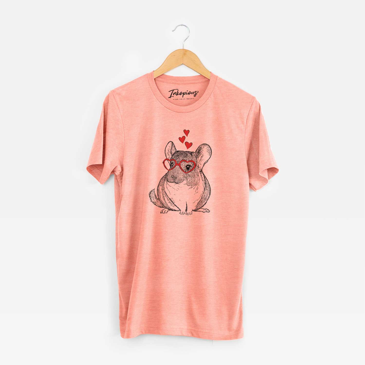 Hand-drawn sketch of Cheddar the Chinchilla wearing heart-shaped glasses on a Sunset Unisex crewneck
