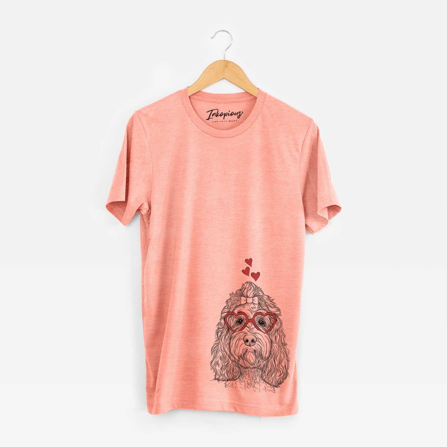 Hand-drawn sketch of Chloe the Cockapoo wearing heart-shaped glasses on a Sunset Unisex crewneck