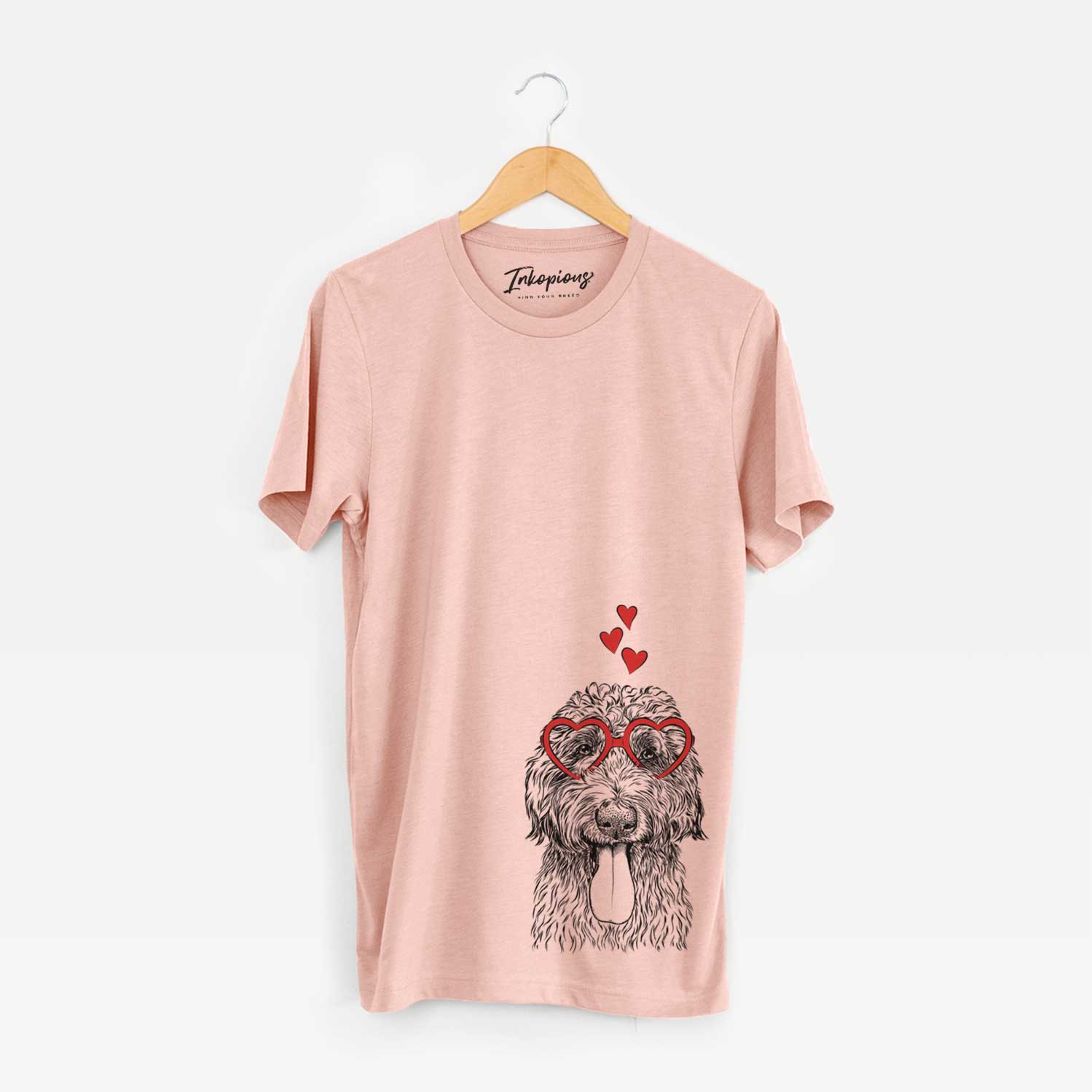Hand-drawn sketch of CiCi Paulk the Aussiedoodle wearing heart-shaped glasses on a Peach Unisex crewneck