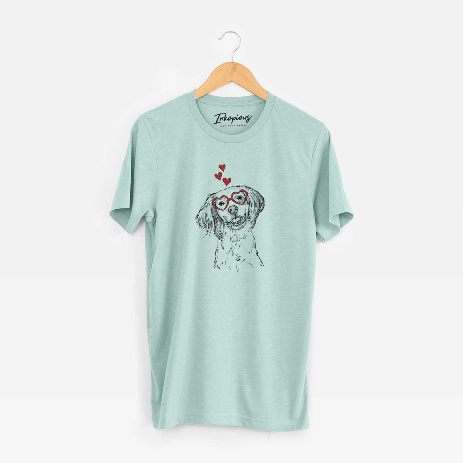 Hand-drawn sketch of Cooper the English Setter wearing heart-shaped glasses on a Heather Sage Unisex crewneck