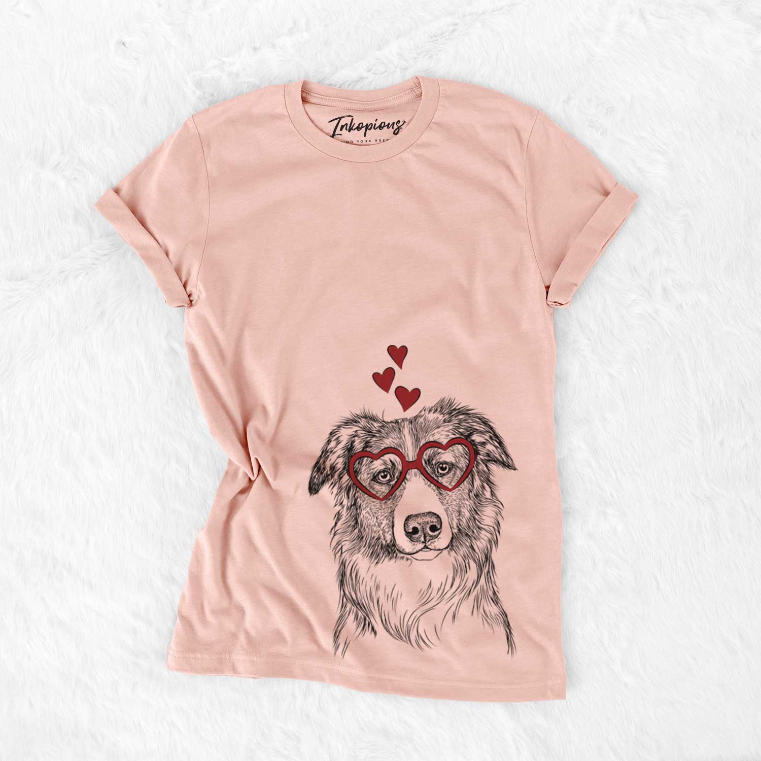 Hand-drawn sketch of Cynder the English Shepherd wearing heart-shaped glasses on a Peach Bella Canvas Unisex Crewneck